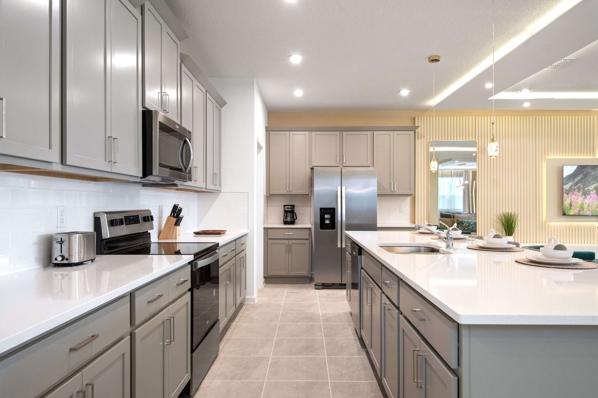 Sleek Chef’s Kitchen with Double Islands, Stainless Appliances & Ample Storage
