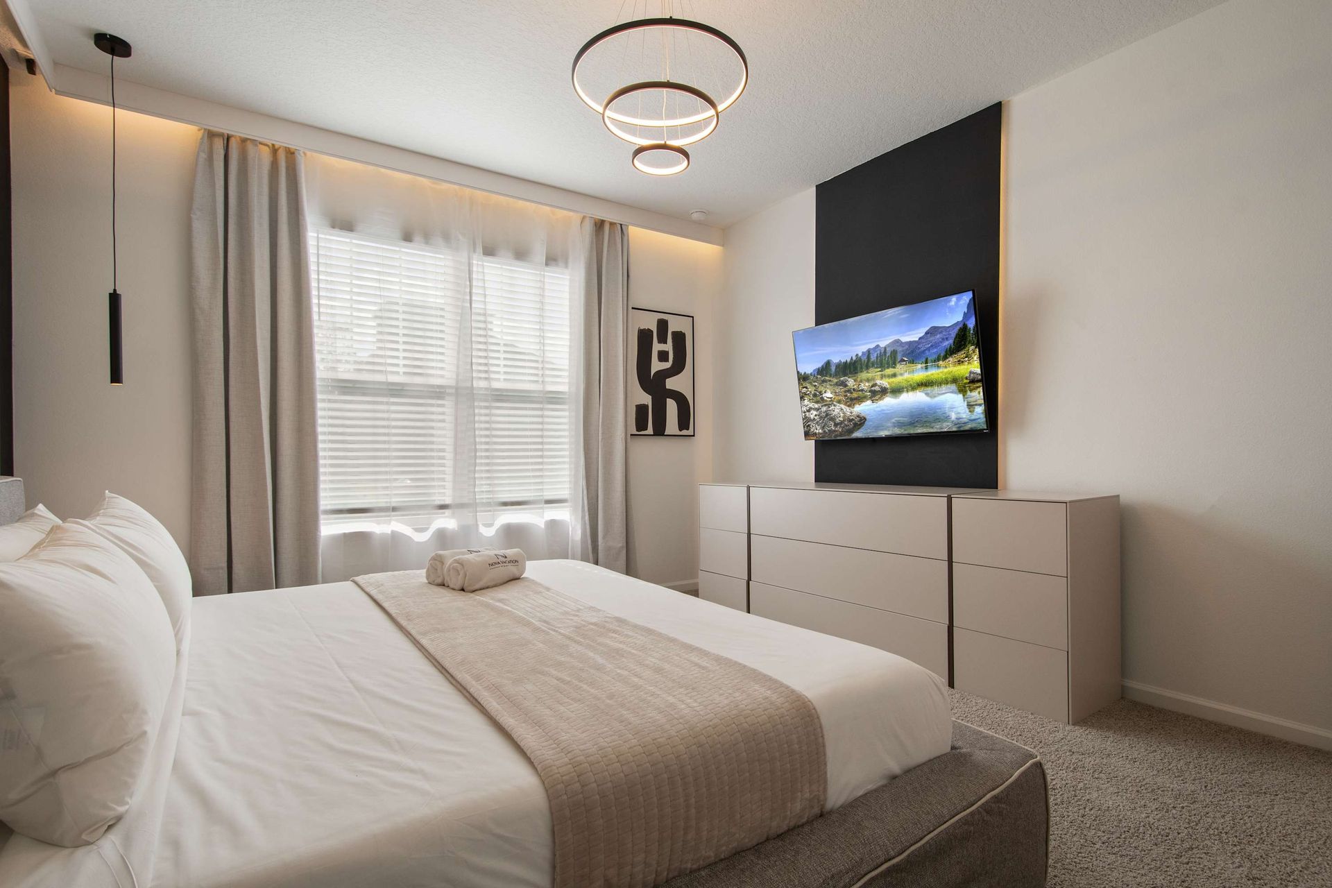 Serene Modern Bedroom with King Bed, Smart TV & Soft Natural Light
