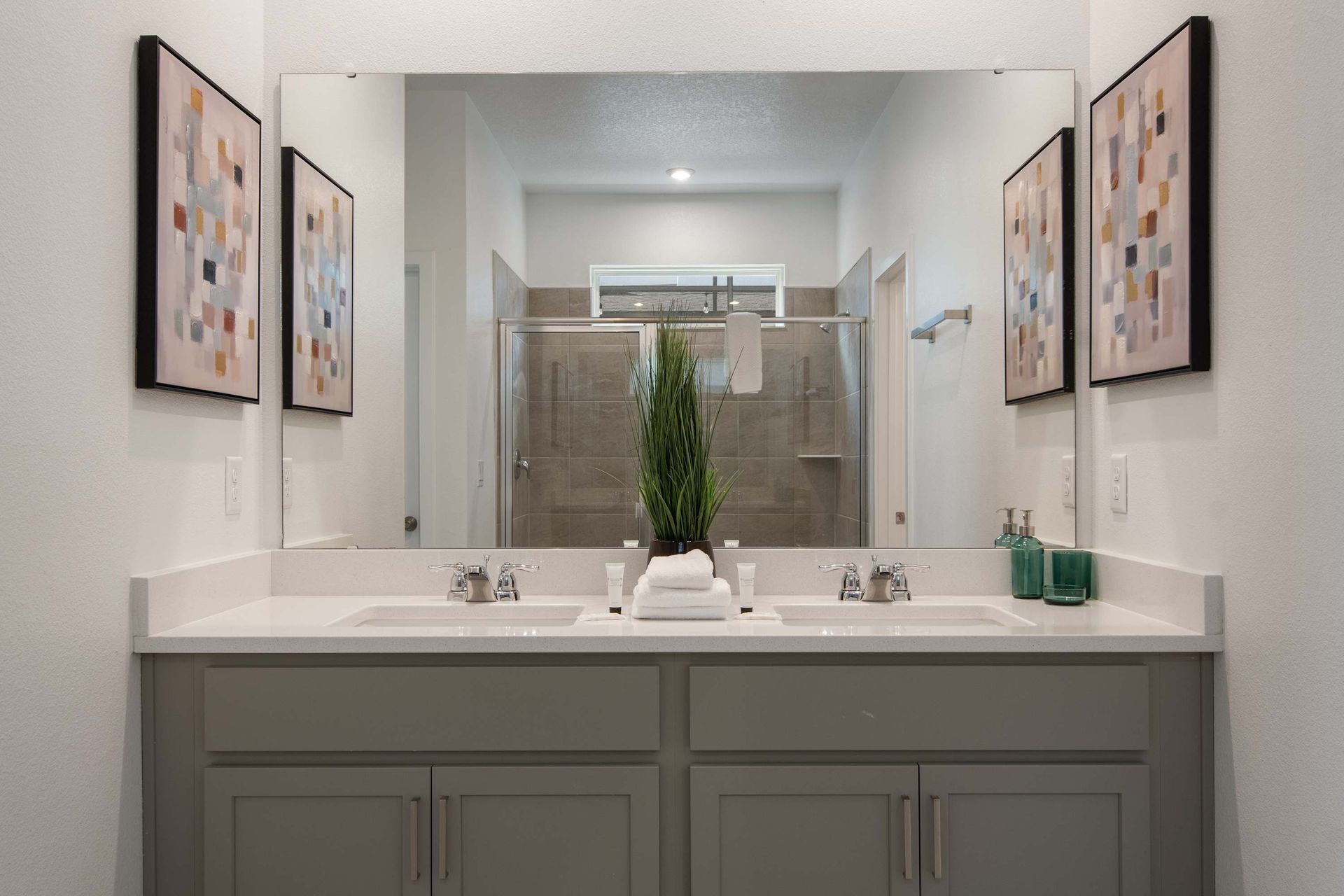Modern Bathroom with Dual Vanity, Large Mirror & Spacious Walk-In Shower
