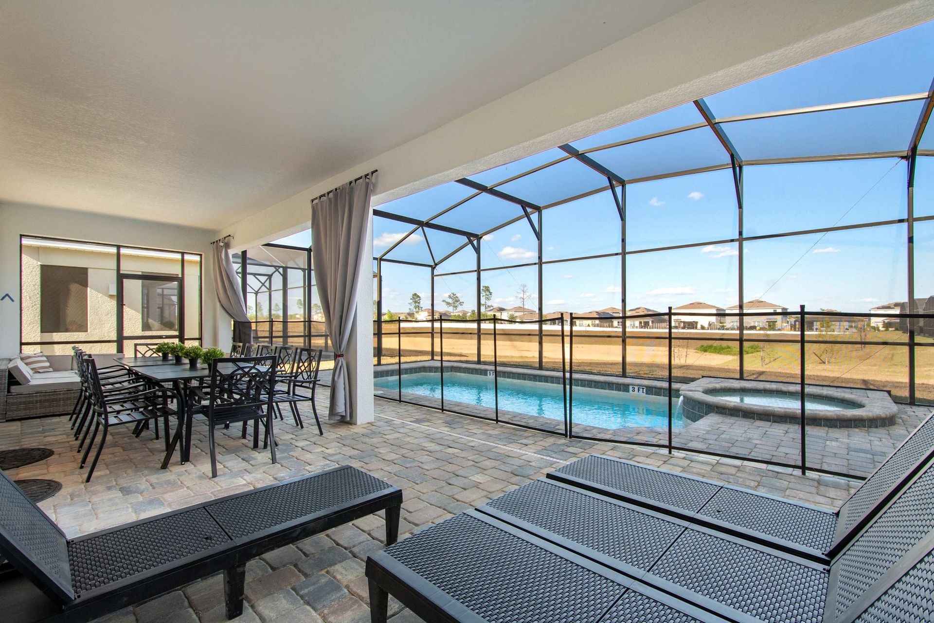 Screened Pool Patio with Lounge Chairs, Dining Area & Peaceful Outdoor Views
