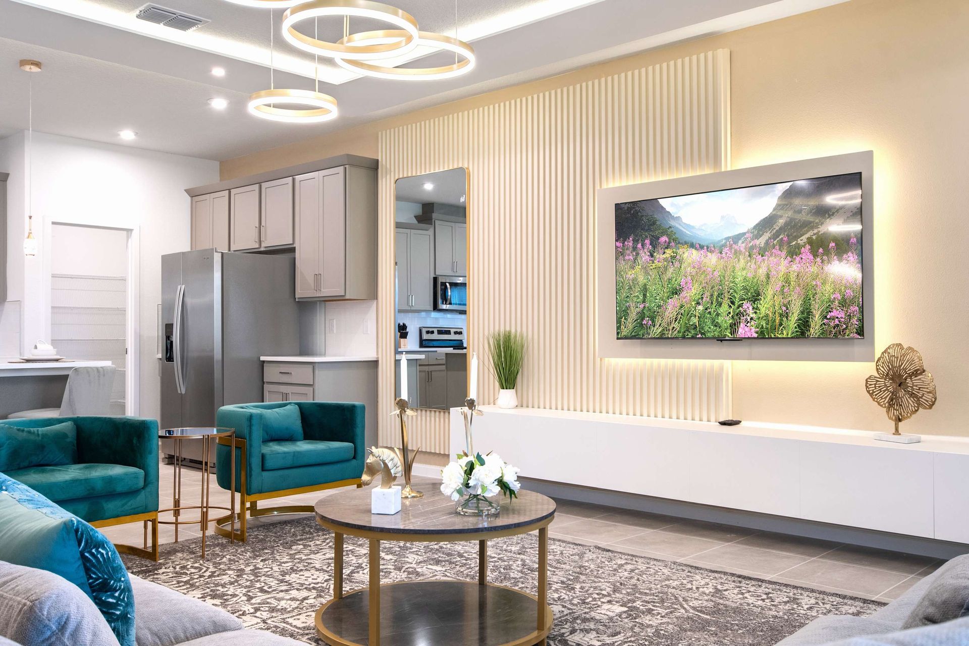 Chic Modern Living Room with Plush Seating, Smart TV, and Elegant Finishes
