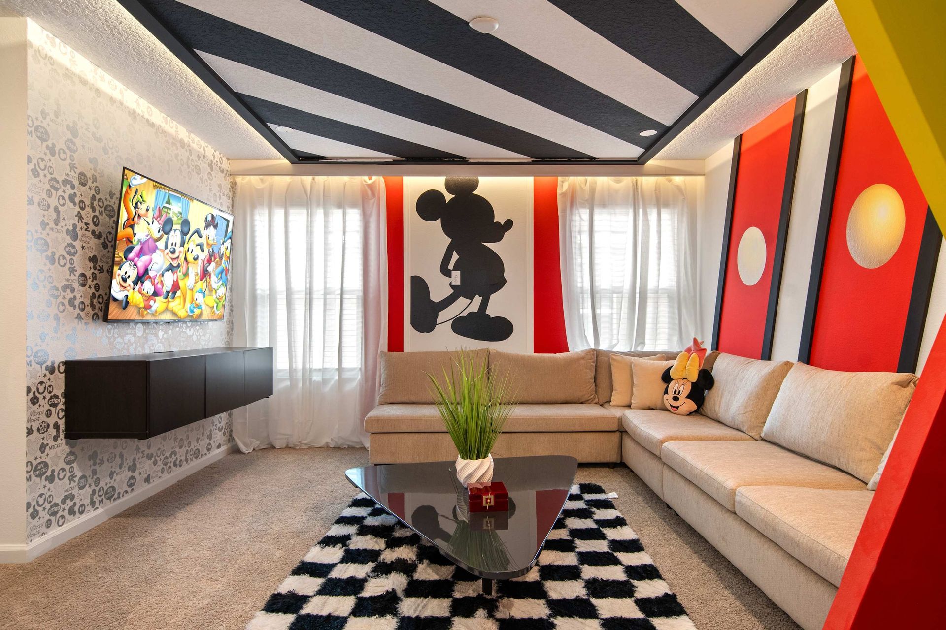 Mickey-Inspired Lounge with Bold Decor, Cozy Sectional & Family-Friendly Fun
