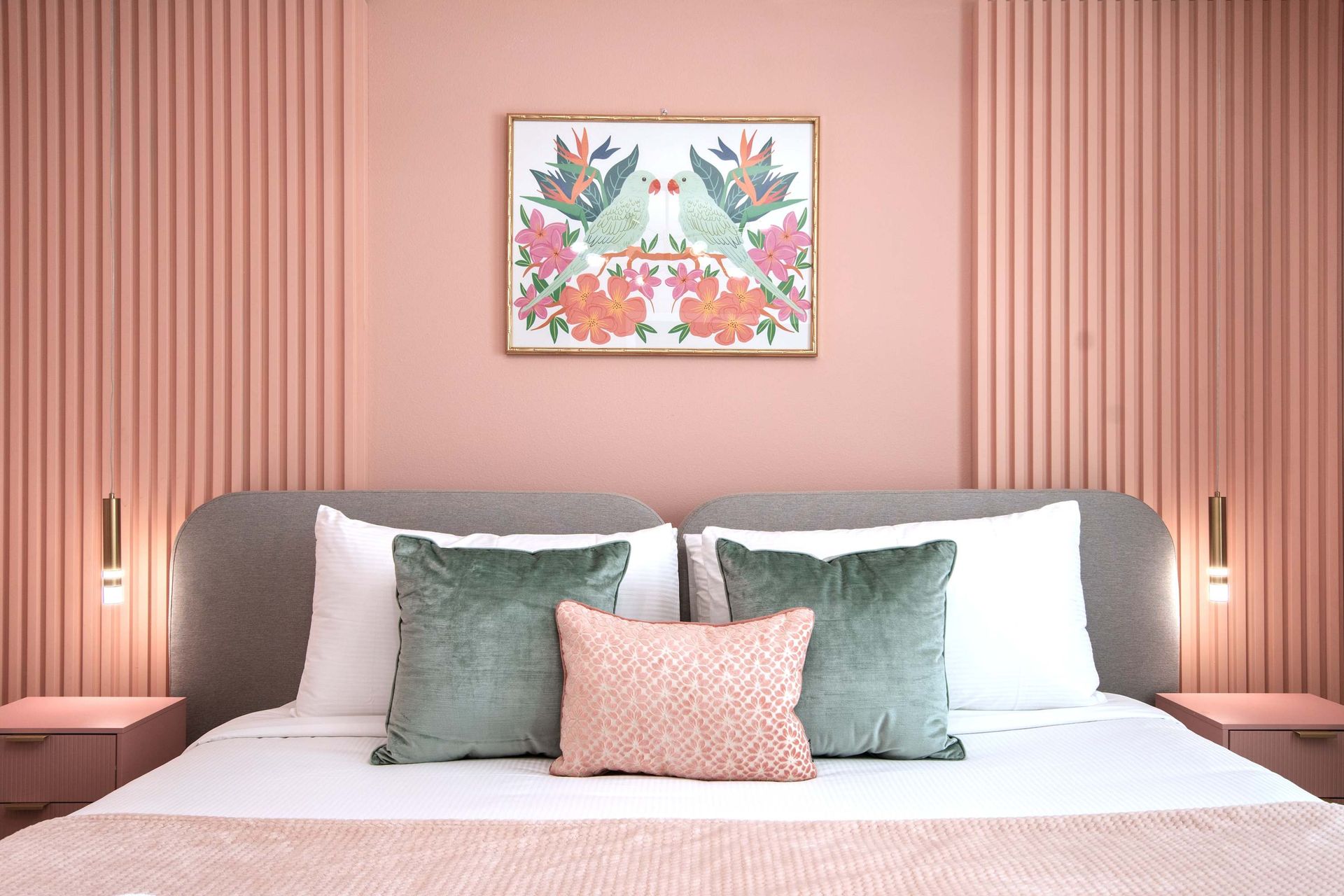 Chic Blush Pink Bedroom with Soft Textures, Modern Lighting & Tropical Art
