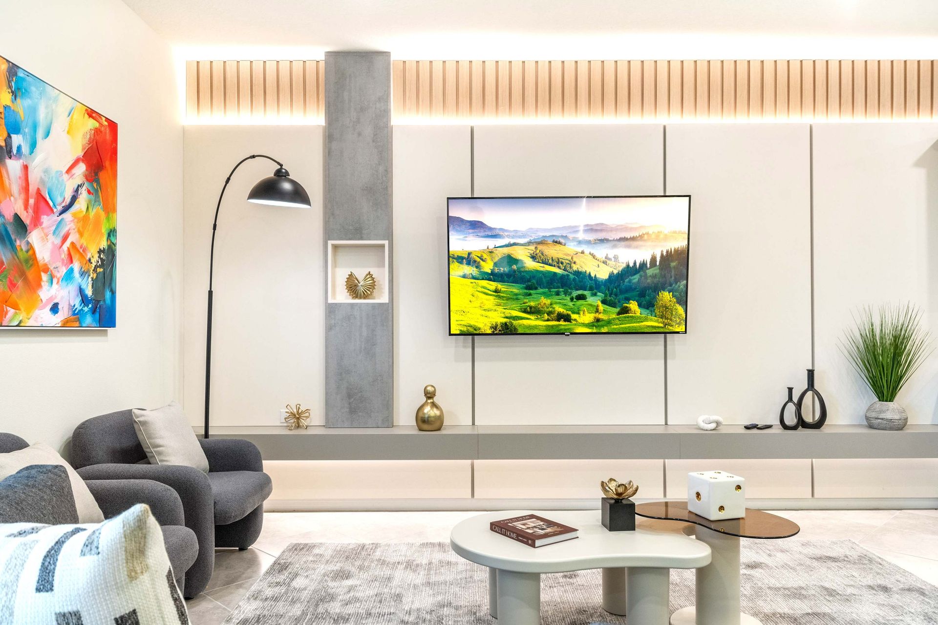 Stylish lounge with modern decor, smart TV, and cozy seating for relaxing nights