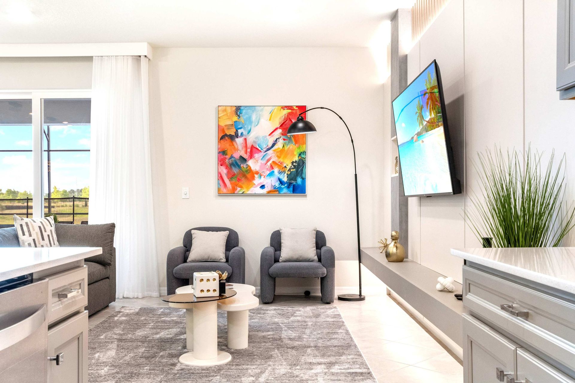 Contemporary lounge with cozy chairs, bold art, and elegant modern decor touches