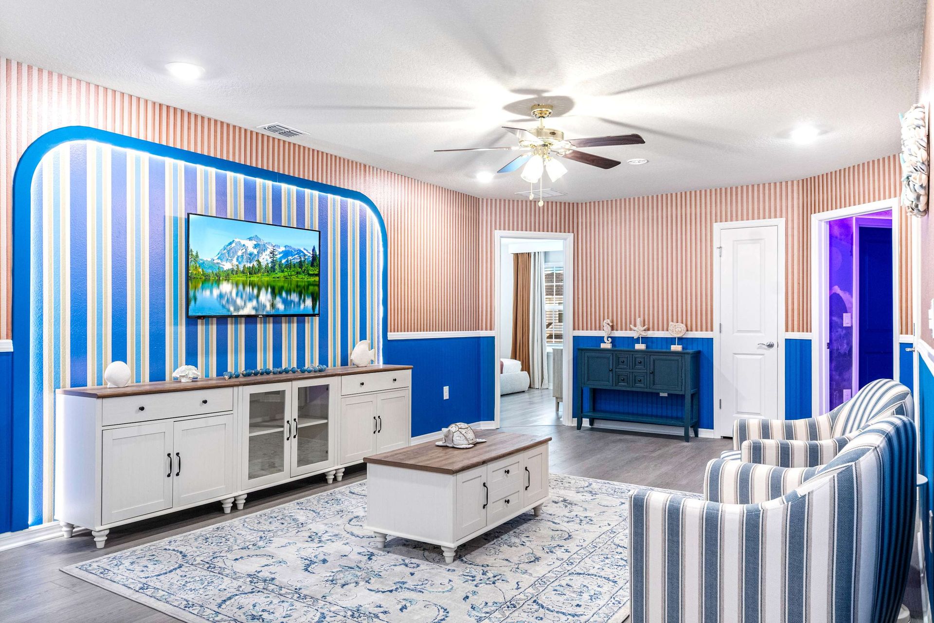 Stylish retreat with bold blue accents, modern charm, and cozy seating spaces