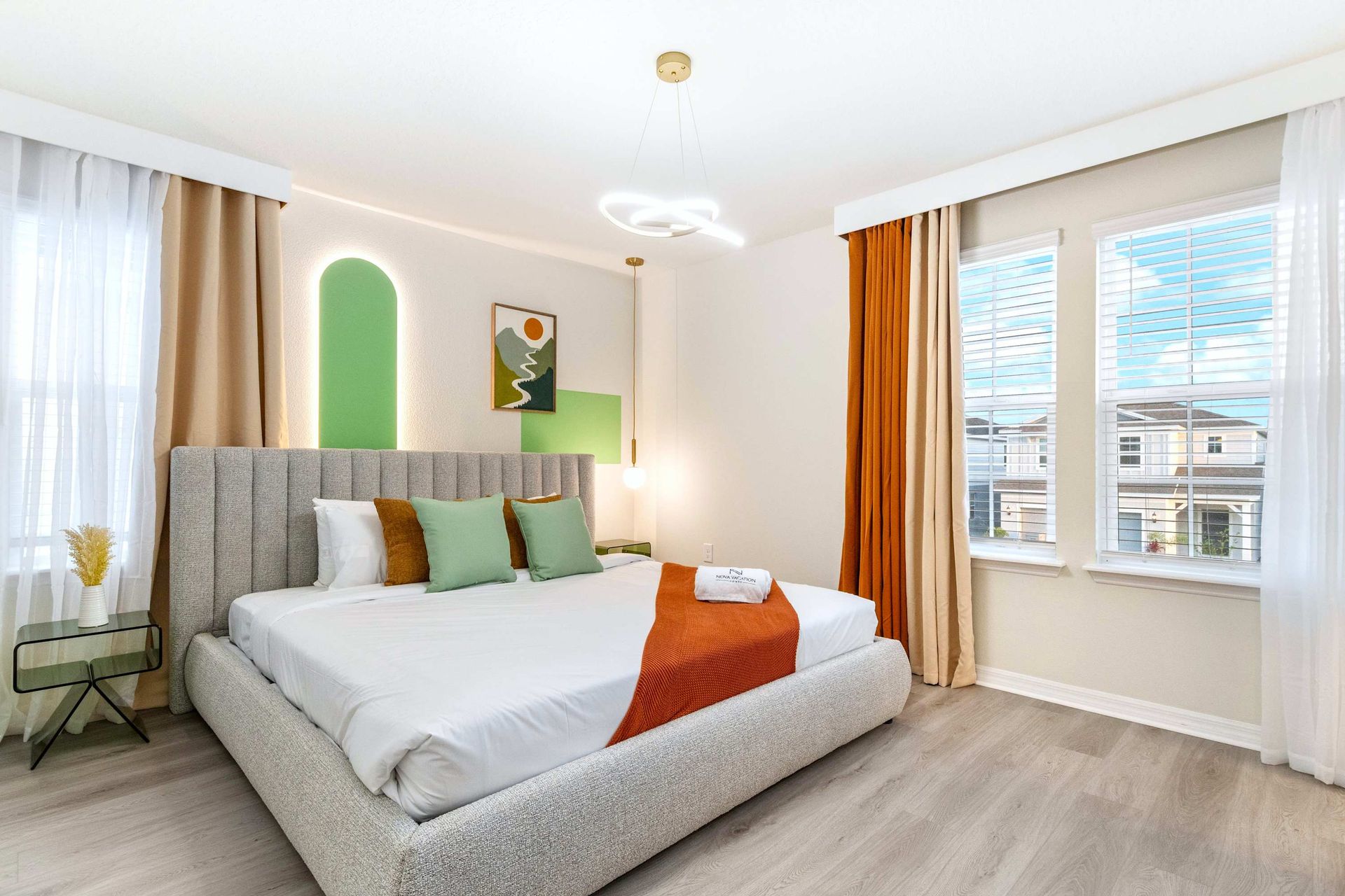 Relax in this bright, modern bedroom with bold colors and natural sunlight.