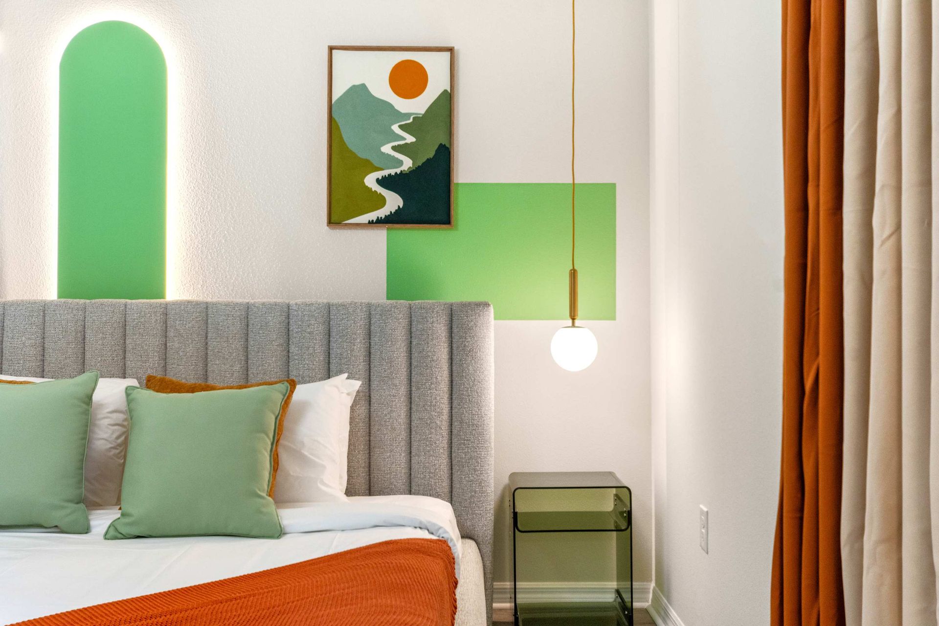 Earthy tones and modern art create a peaceful, stylish space to unwind and rest.