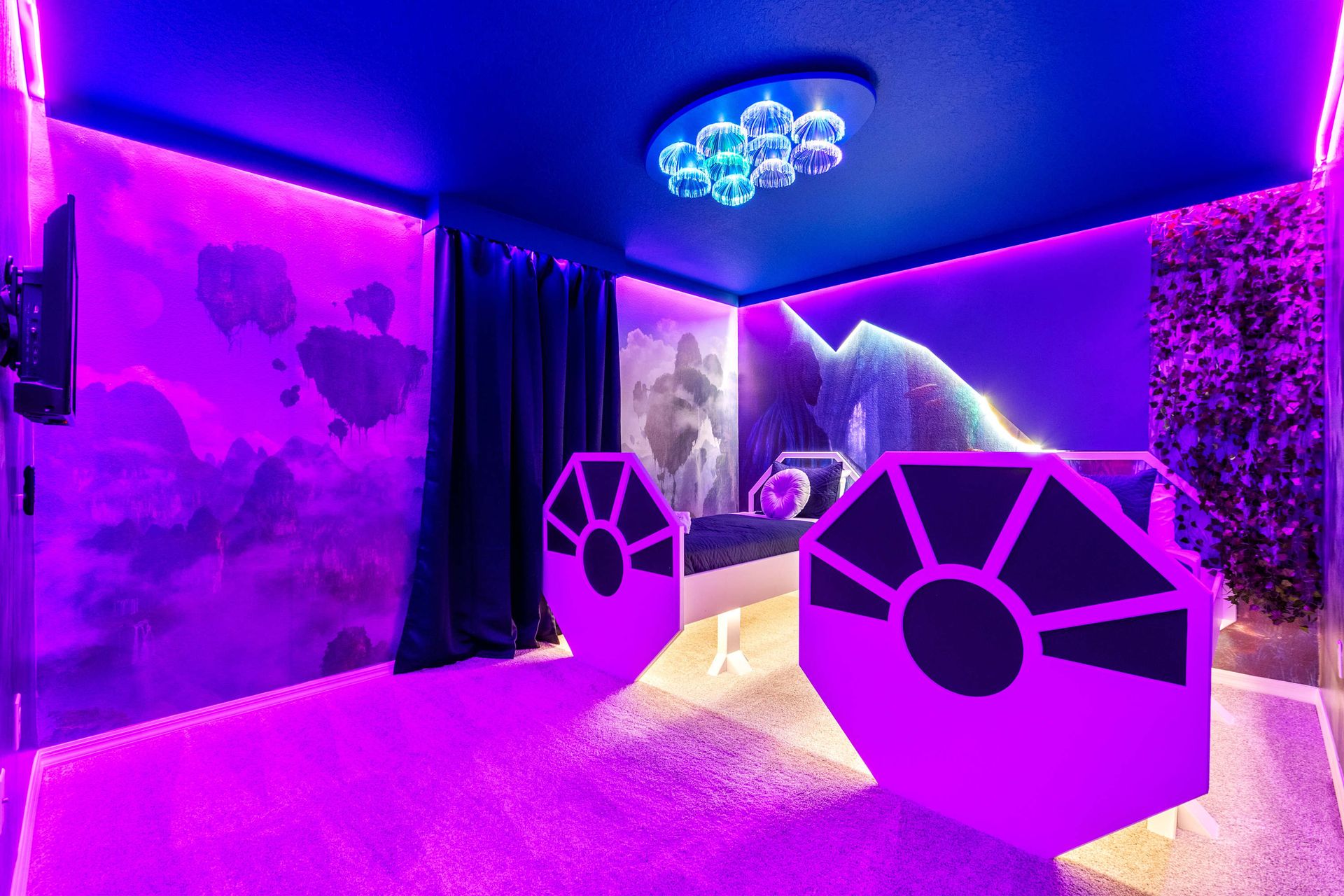 Blast off to dreamland in this glowing galactic room with starfighter beds!