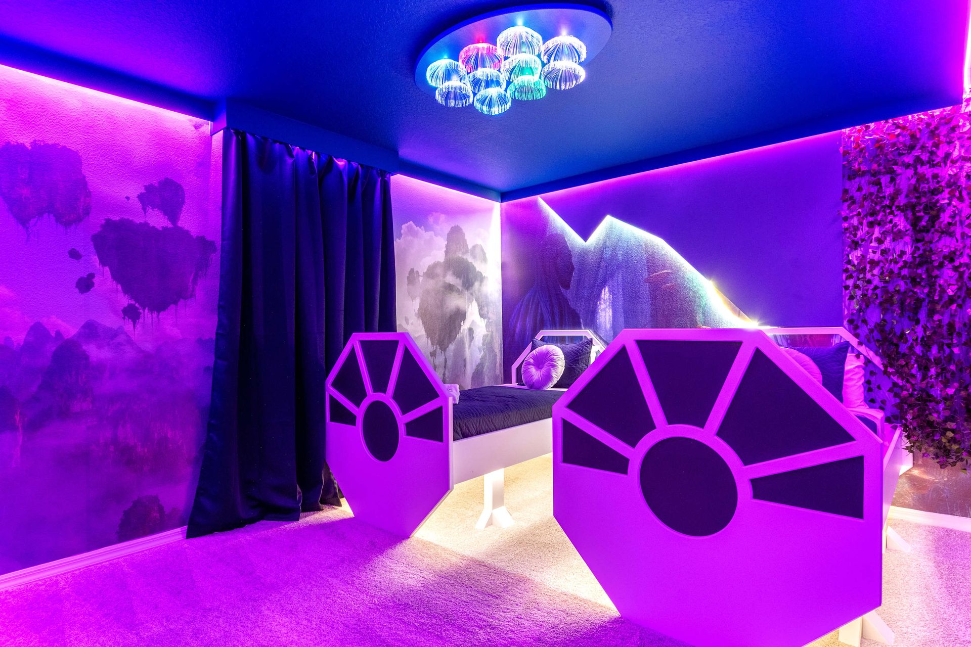 Blast off to dreamland in this glowing galactic room with starfighter beds!