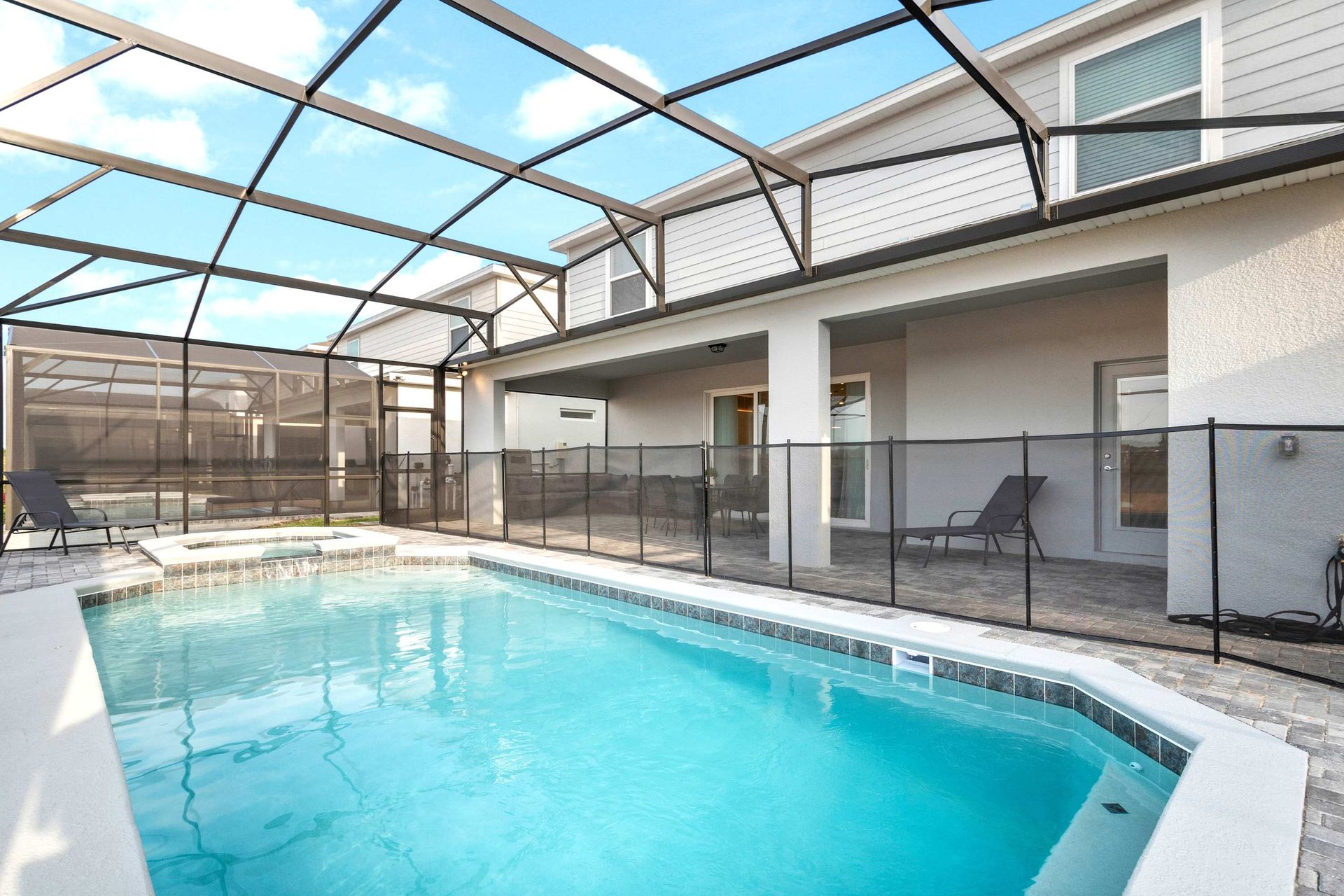 Enjoy your own private screened pool and spa with loungers and shaded patio.