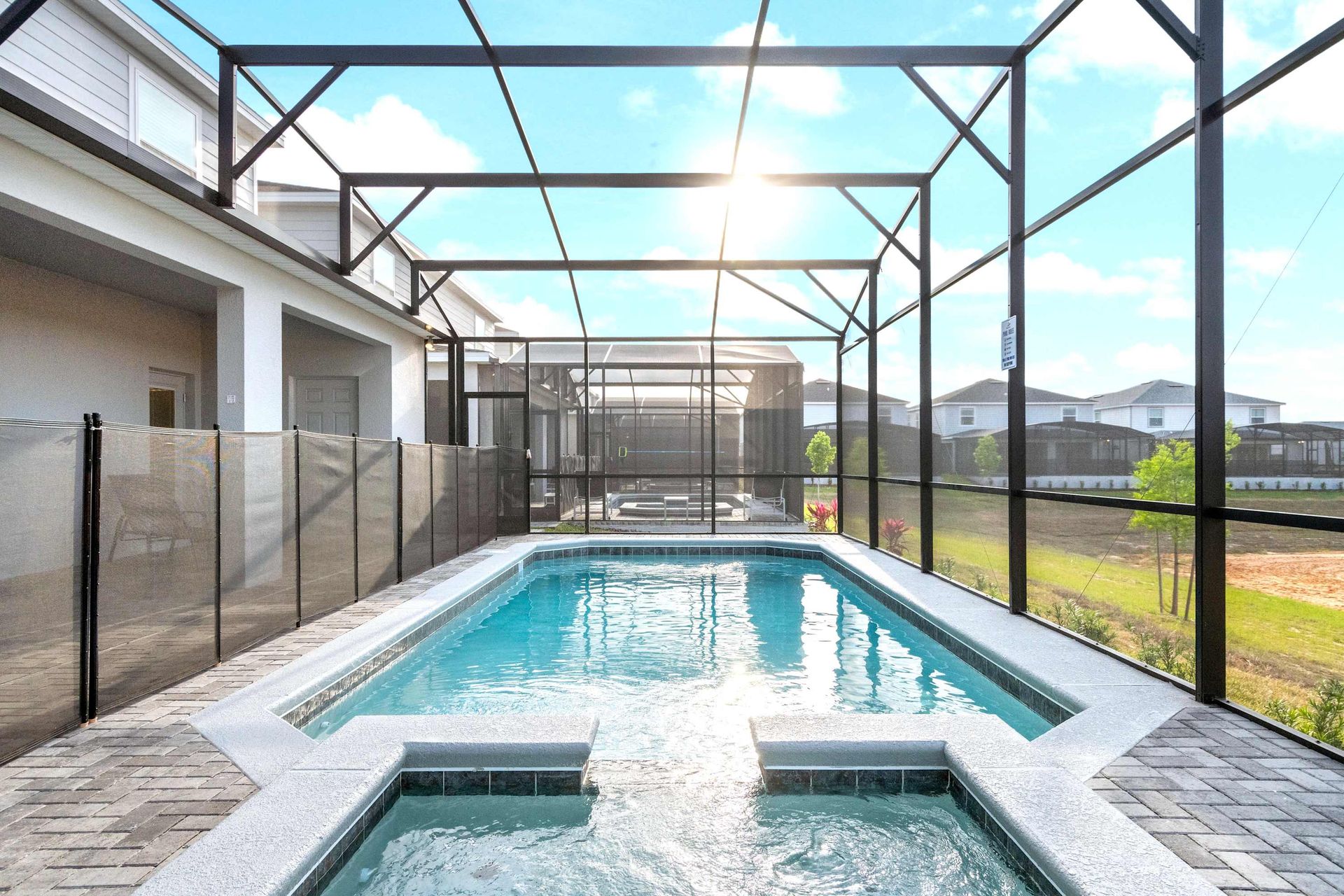 Private screened pool and spa with sun-soaked deck and peaceful open views.