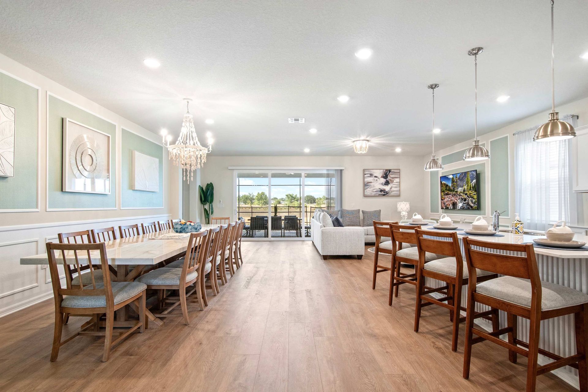 Spacious open layout with gourmet kitchen, elegant dining, and bright living area.
