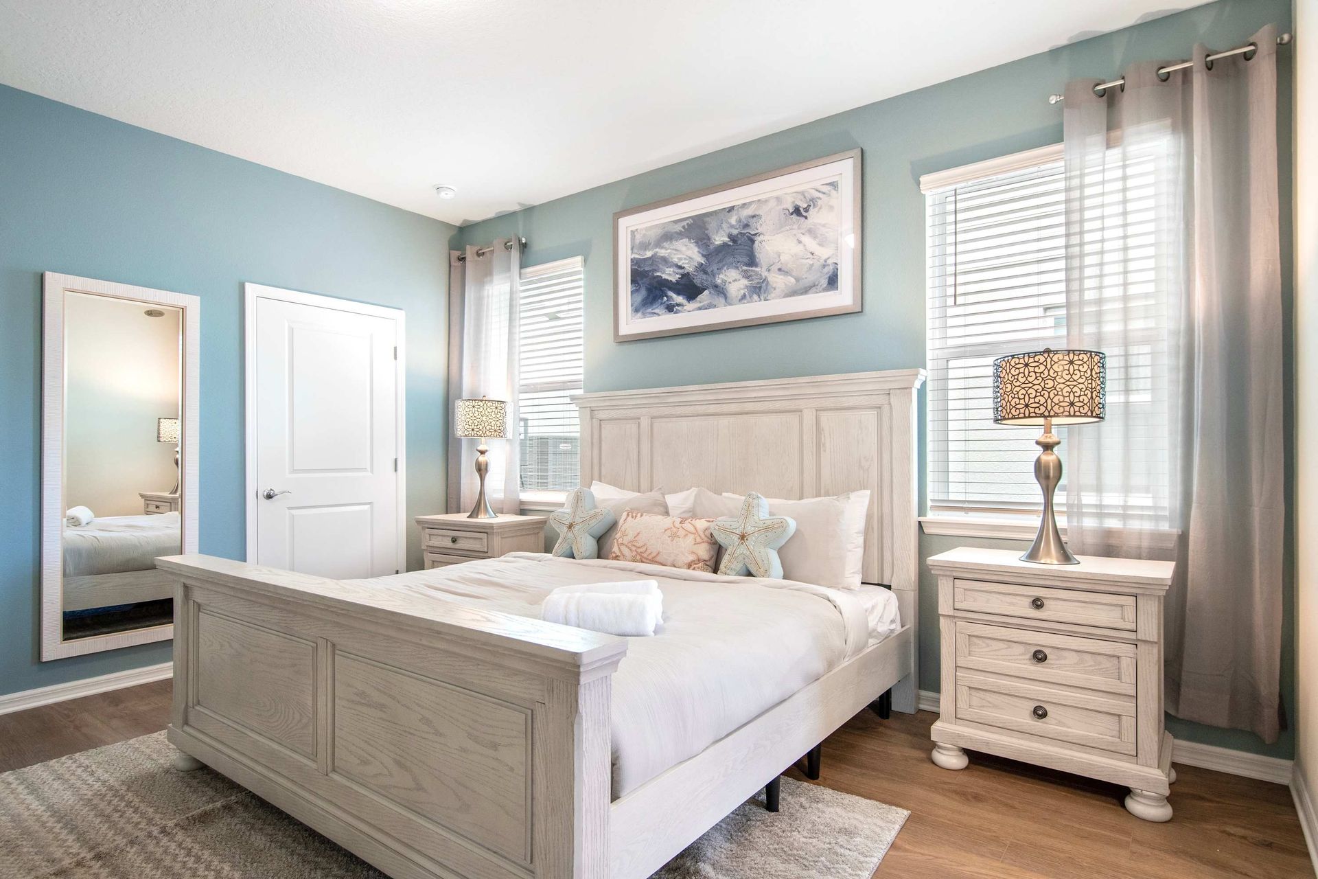 Tranquil bedroom retreat with soft tones, plush bedding, and natural light.
