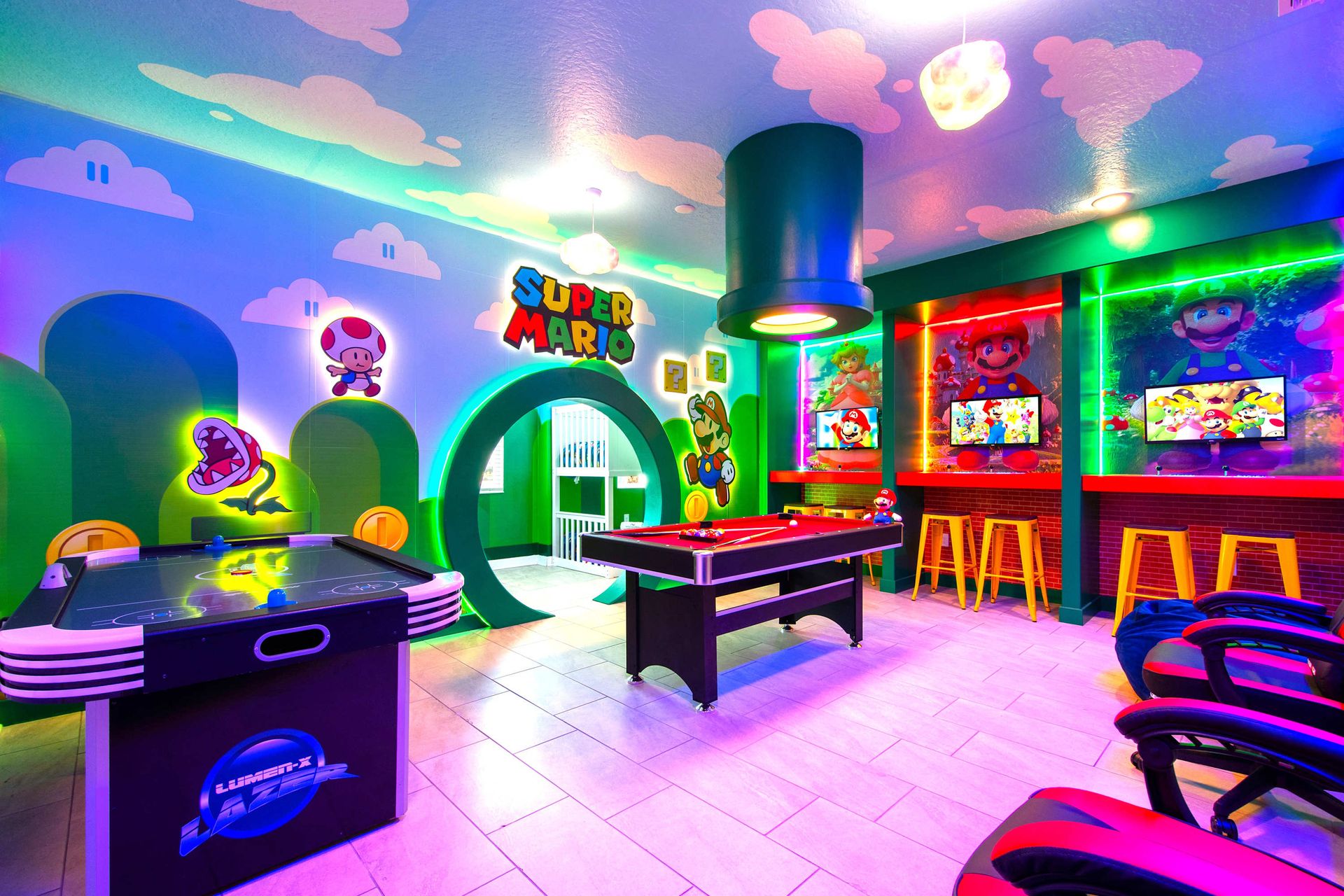 Epic Super Mario game room with arcade games, pool, air hockey, and neon glow!
