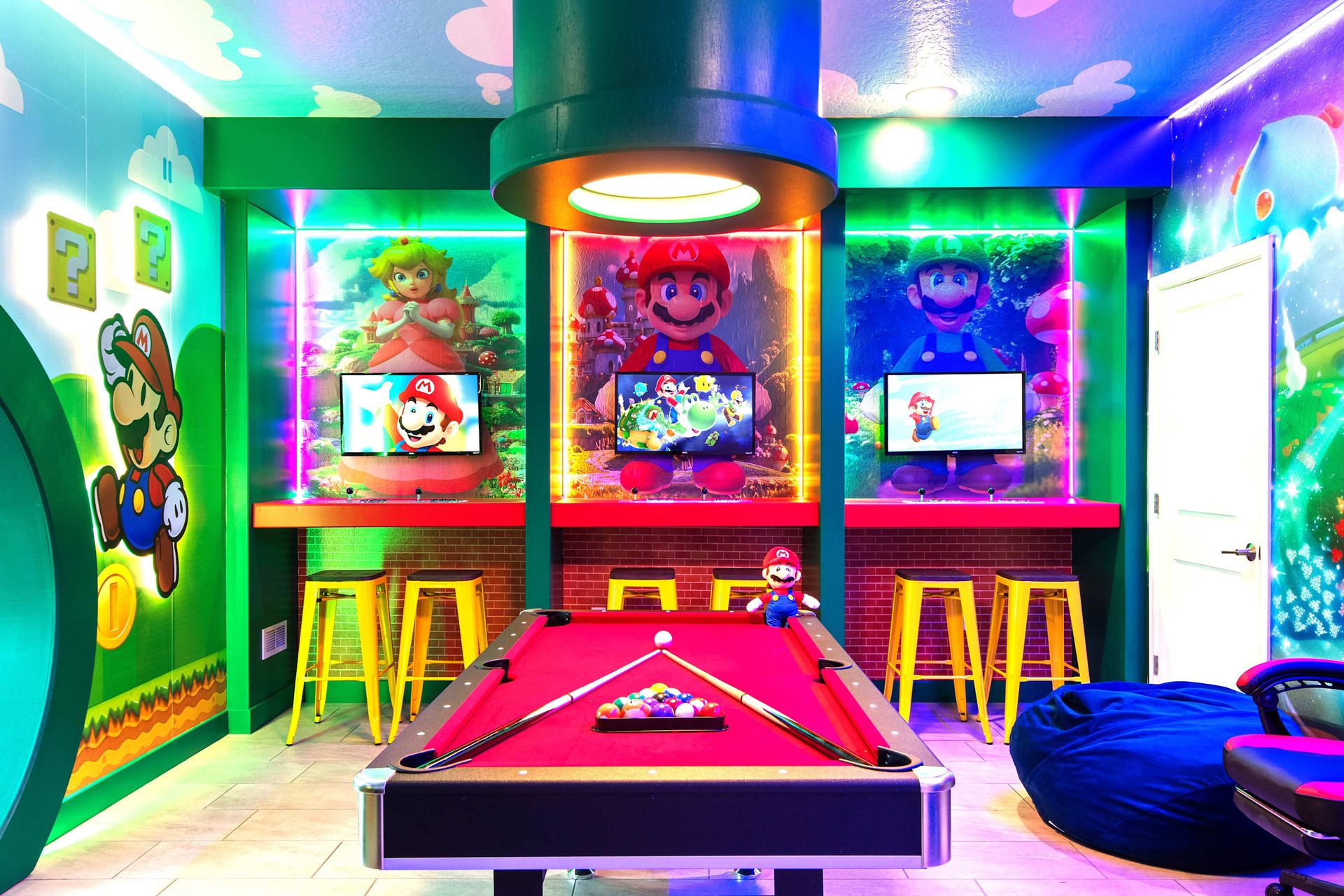 Super Mario-themed game room with pool, air hockey, and vibrant decor fun!
