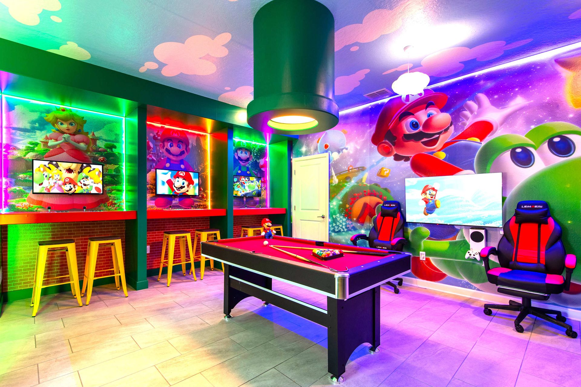 Super Mario gaming lounge with vibrant neon lights, wall art, and console setups!
