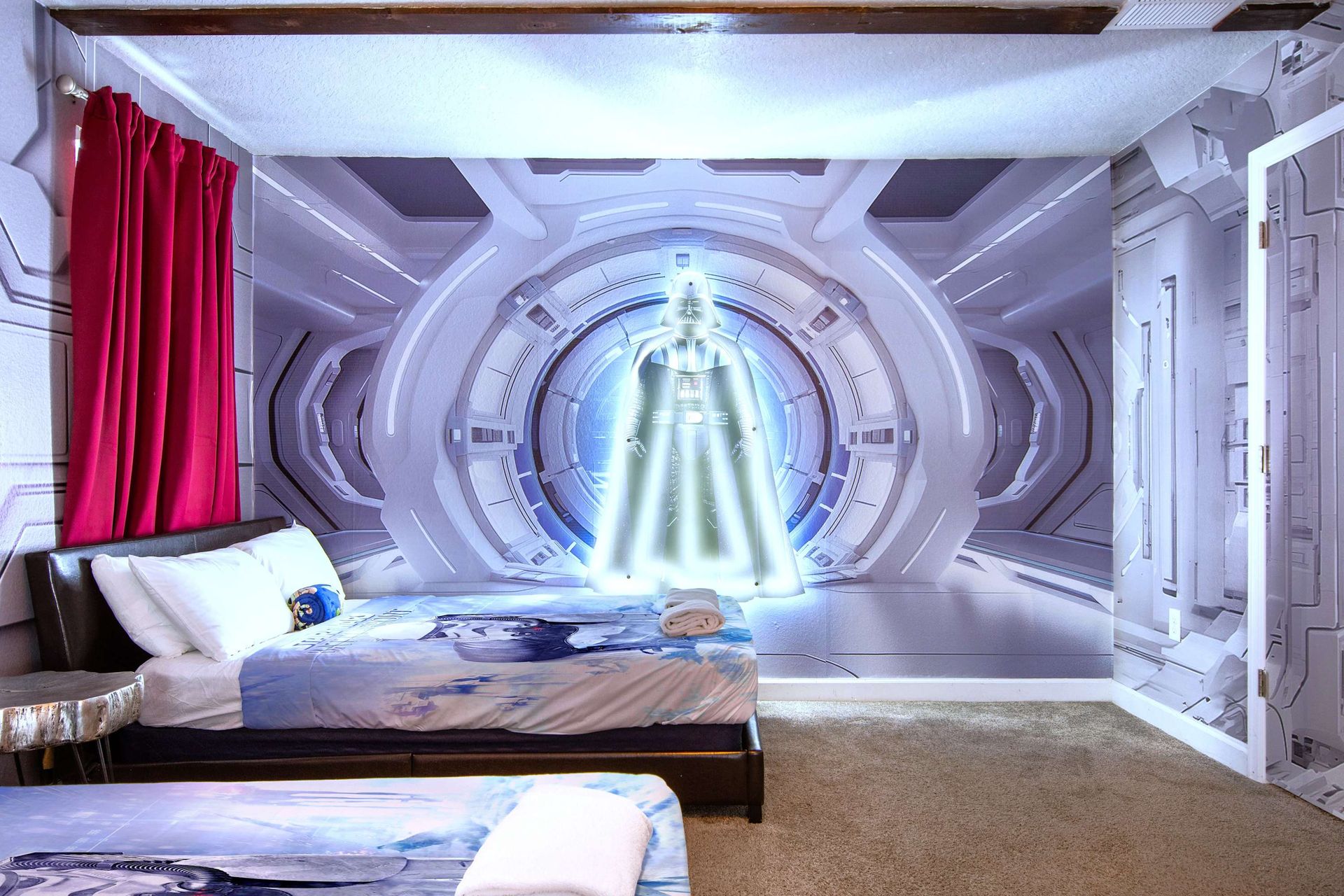 Galactic-themed bedroom with stunning wall art and cozy twin beds for kids.
