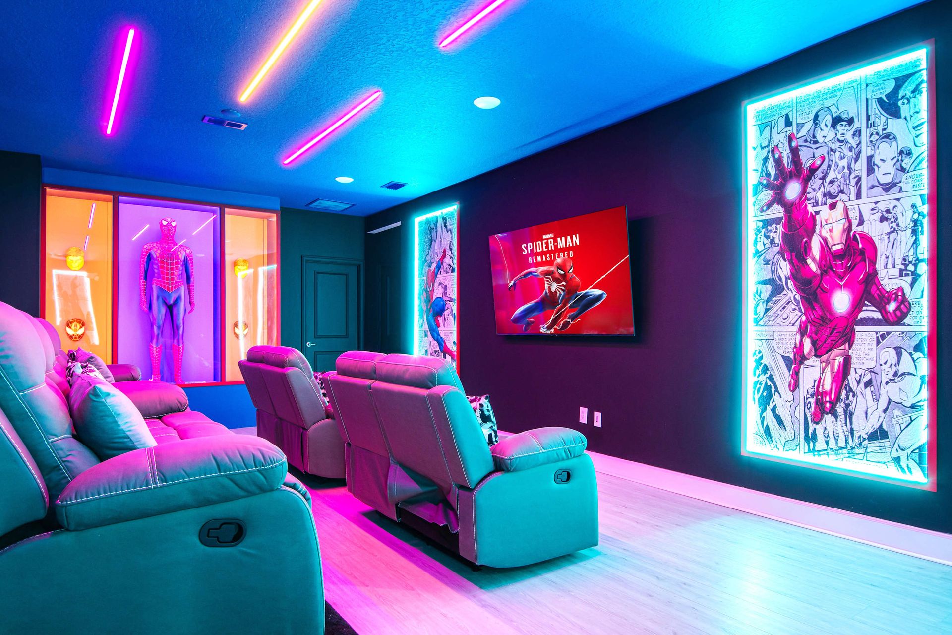 Epic superhero-themed theater with neon lights, recliners, and immersive sound
