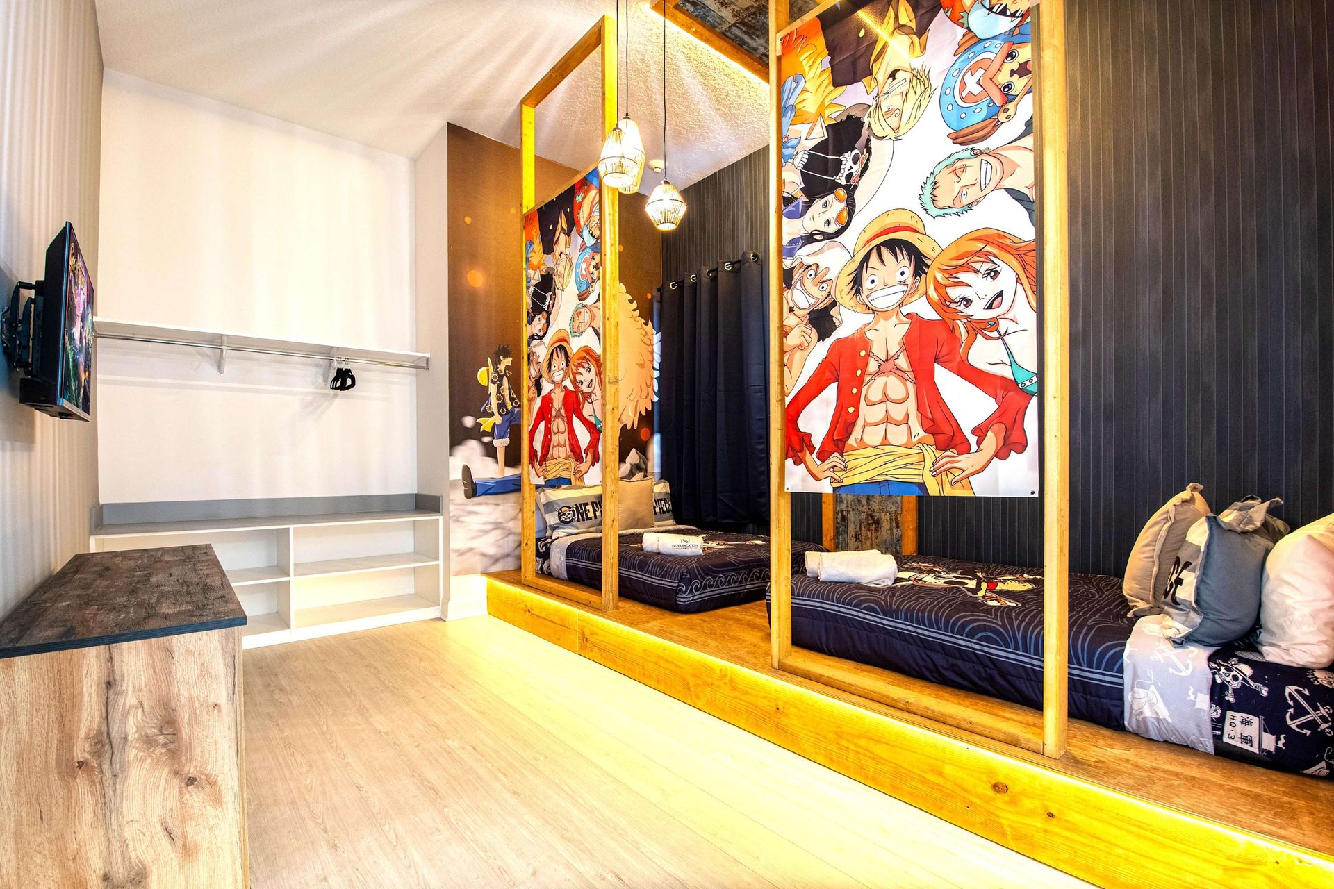 Anime-themed bunk room with vibrant decor, cozy beds, and playful character art
