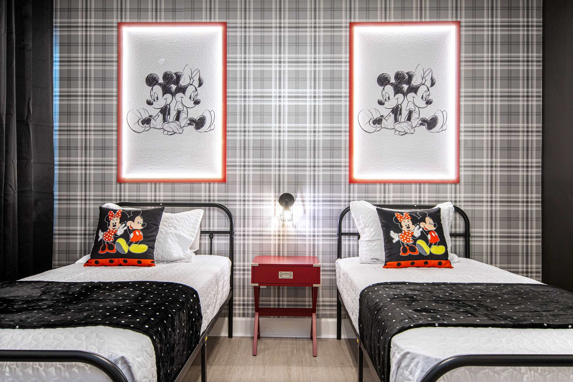 Chic twin room with stylish Mickey Mouse art and modern, cozy design details.
