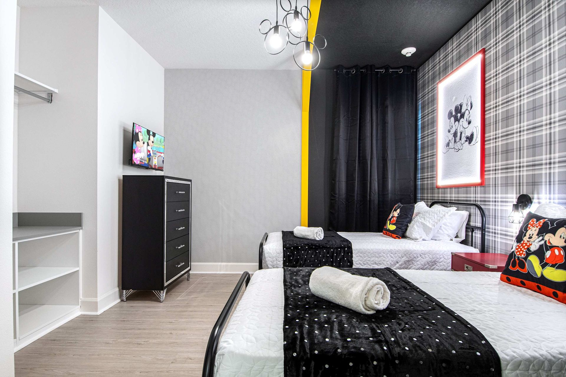 Charming twin room with classic character theme, bold patterns, and playful style
