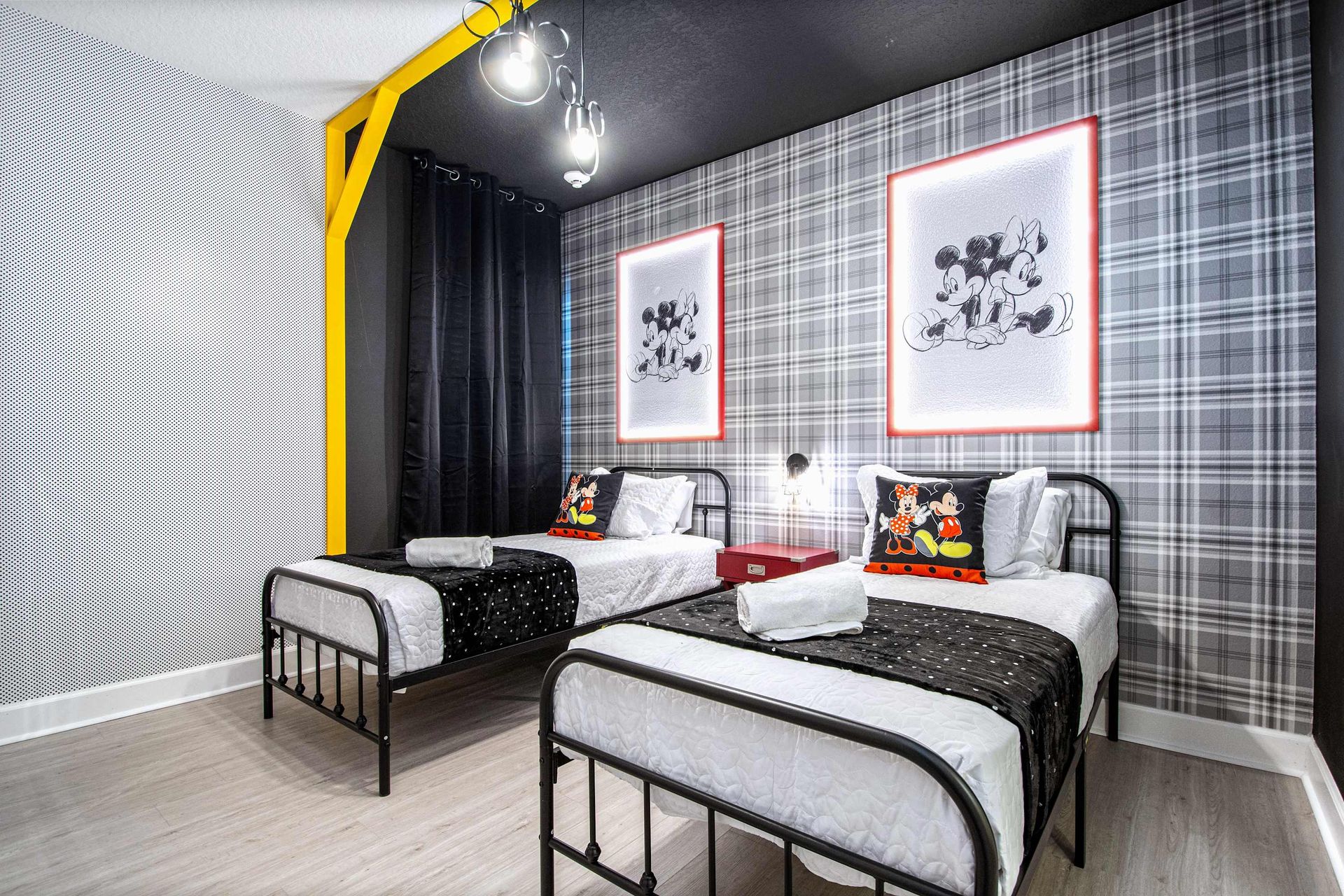 Charming twin room with classic character theme, bold patterns, and playful style
