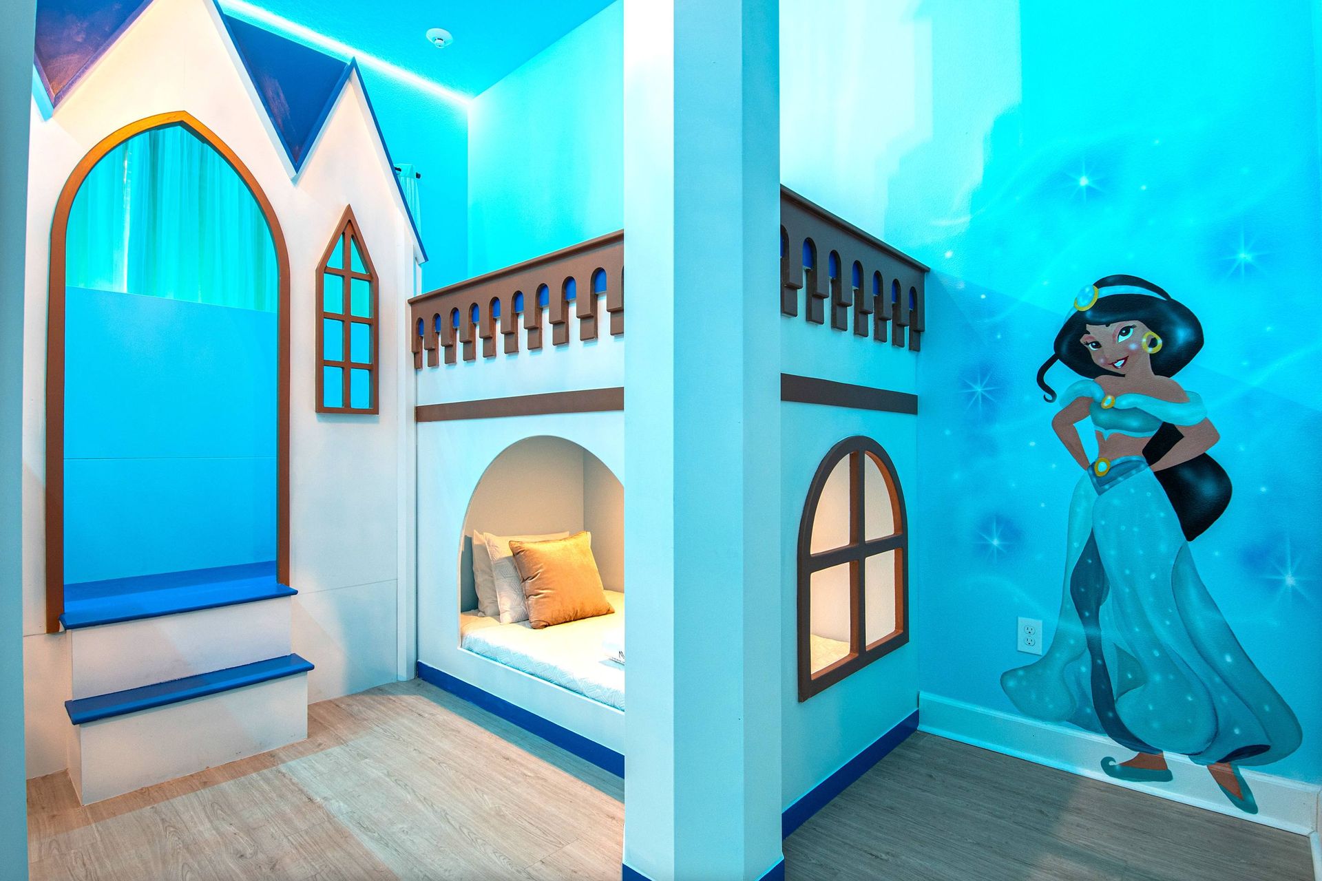 Magical princess-themed room with castle bunk beds and enchanting royal decor
