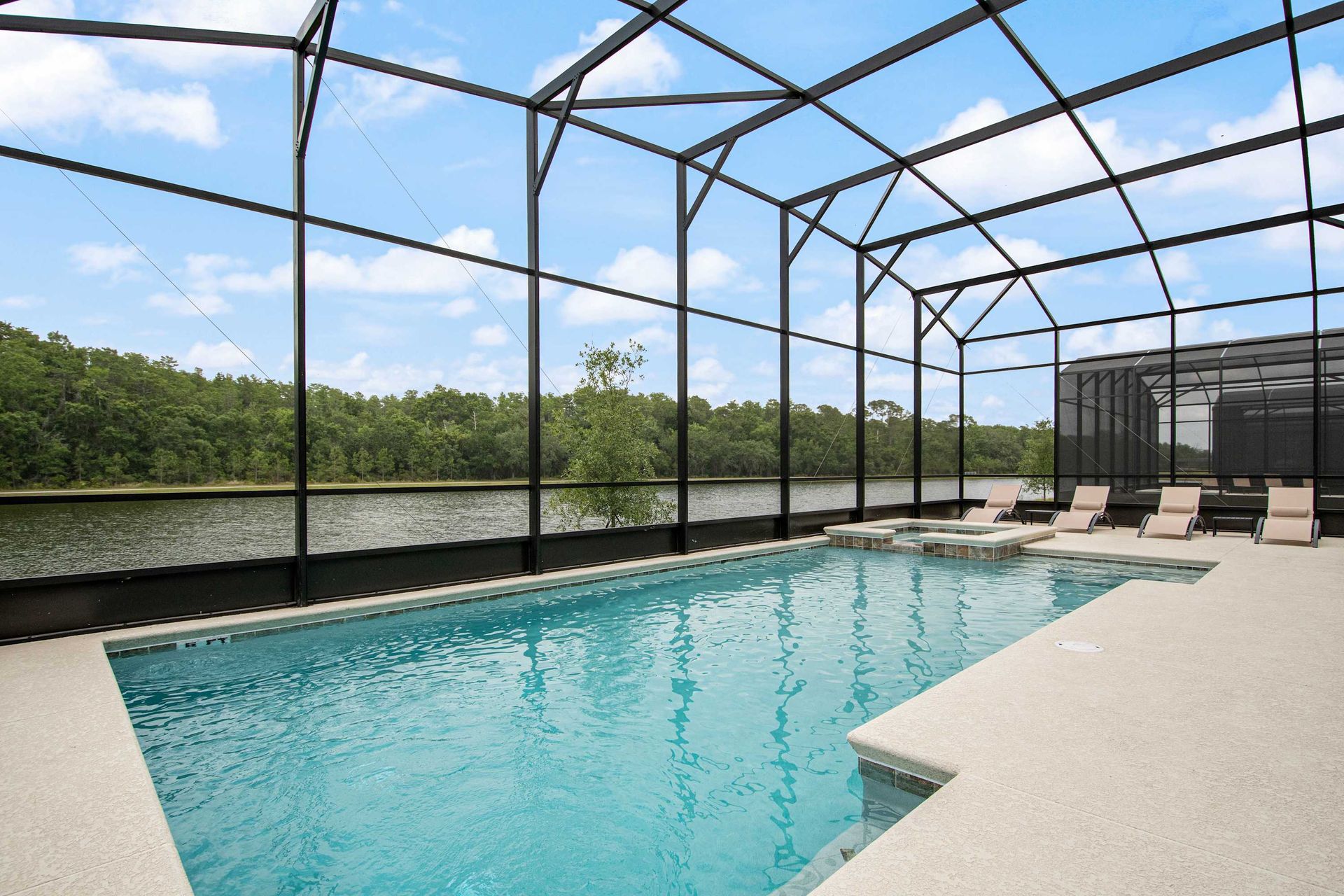 Relax by private screened pool overlooking serene lake views; ultimate tranquility.
