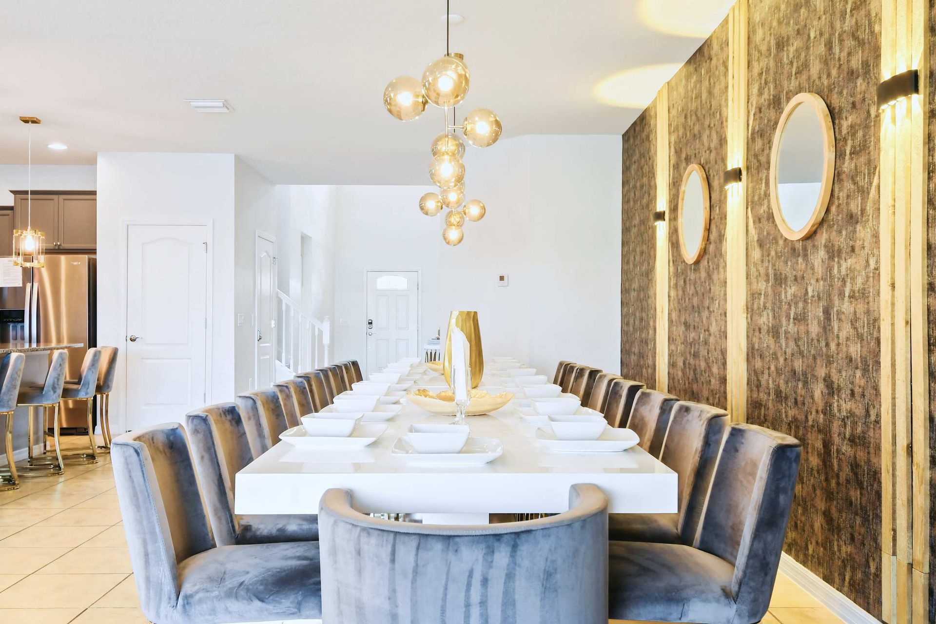 Luxurious dining area with seating for 20, elegant lighting, and designer finishes.
