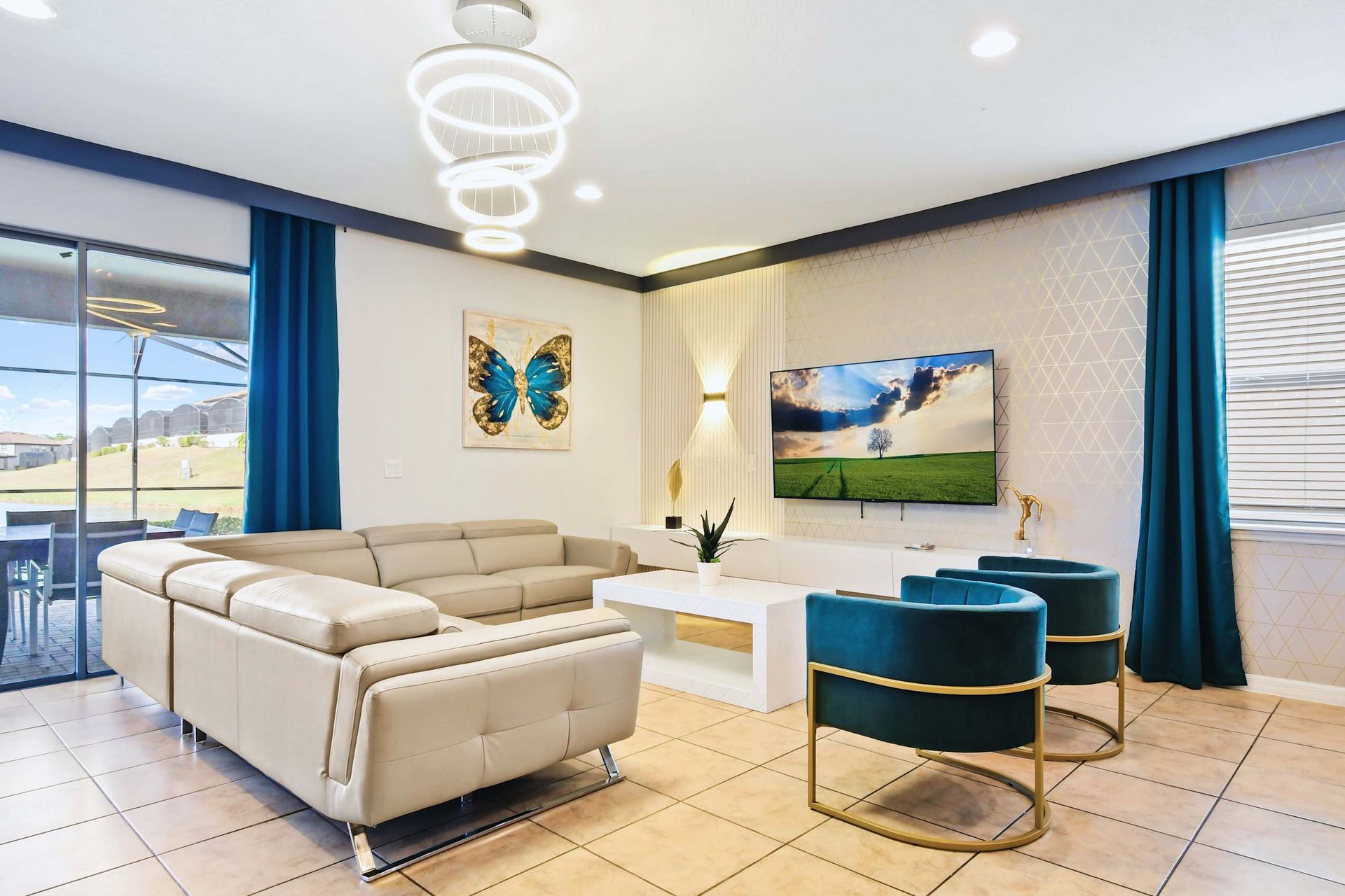 Chic living room with modern decor, bold accents, and a sleek entertainment setup.
