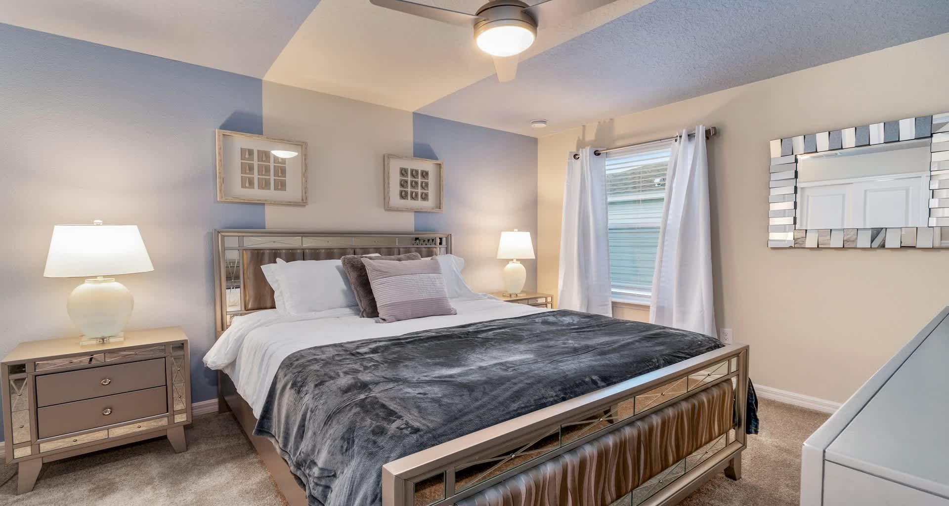 Cozy modern bedroom with sleek metal bed, soft lighting, and calming neutral tones!
