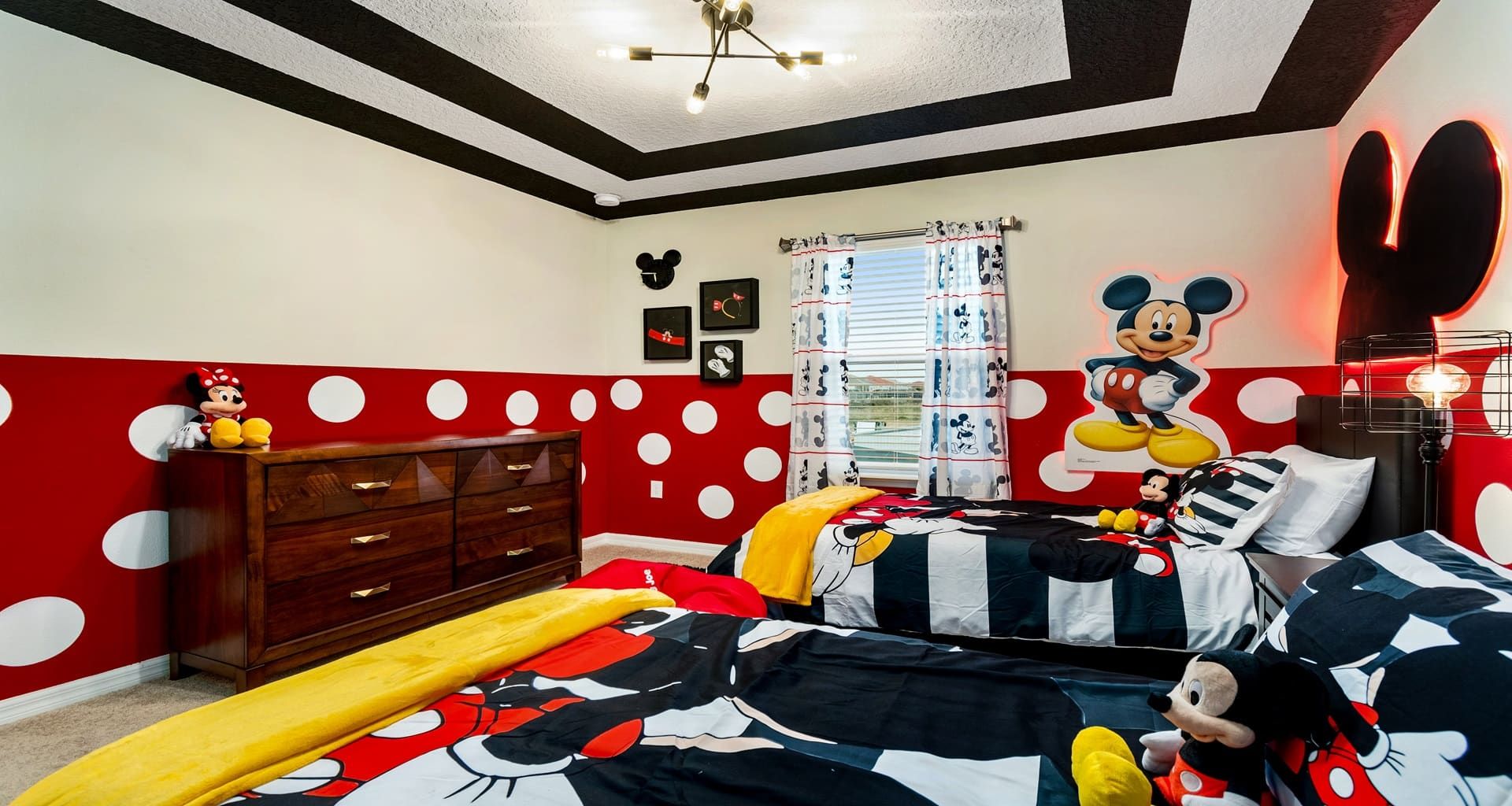 Playful Mickey Mouse bedroom with twin beds, bold colors, and Disney magic!
