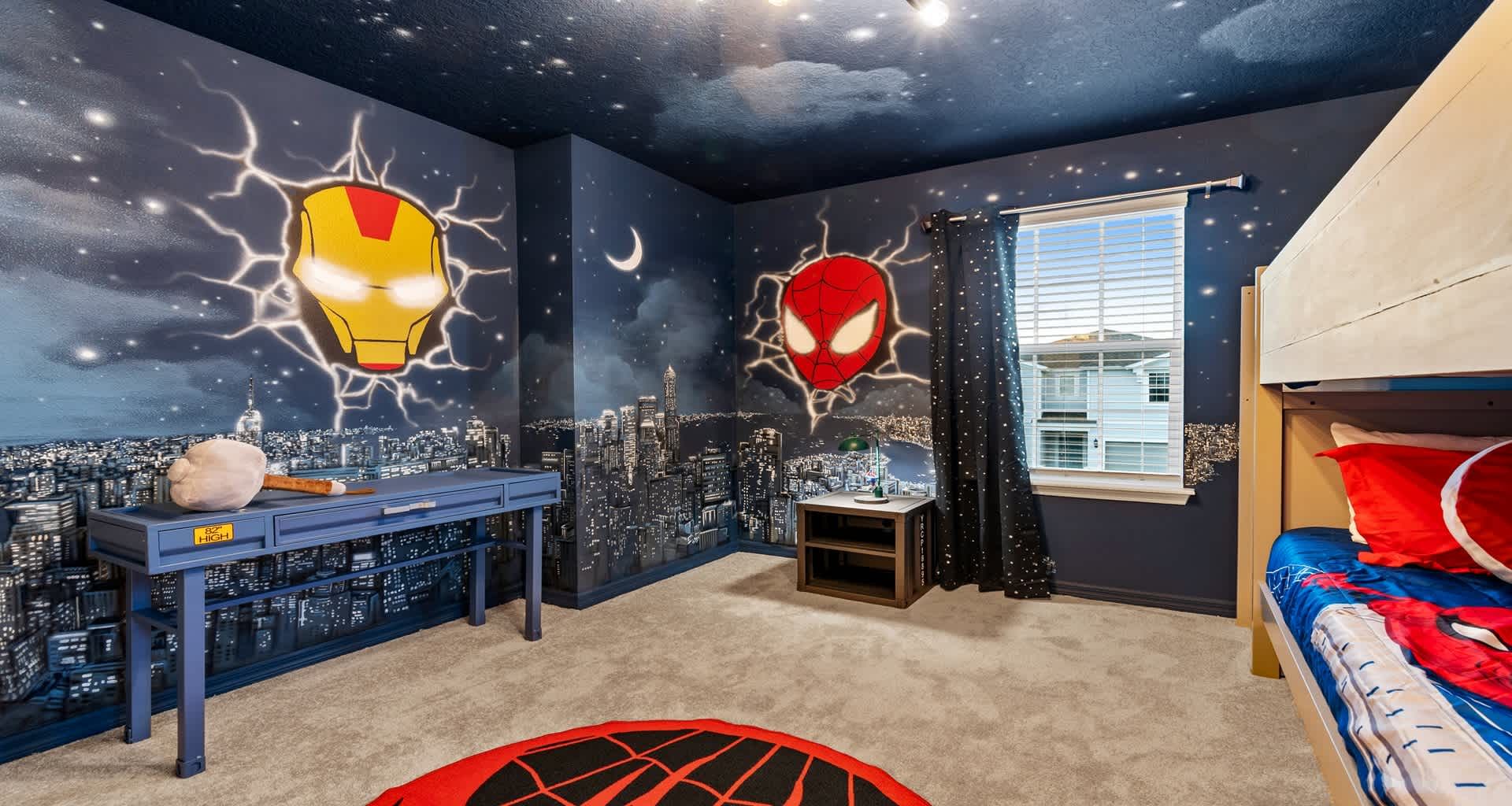 Vibrant Spider-Man and Iron Man kids’ room with bunk beds and cityscape walls!
