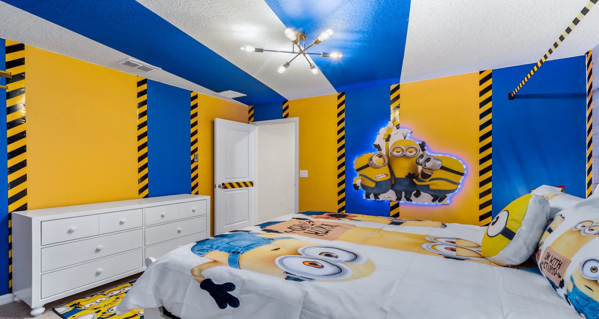 Minions-themed bedroom bursting with color, fun wall art, and playful bedding.
