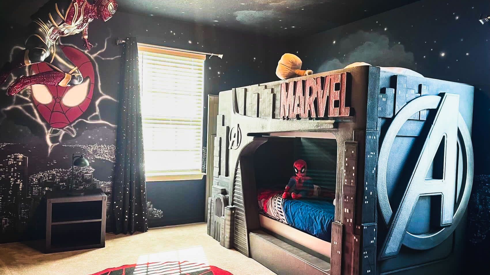 Epic Marvel-themed bunk room with superhero décor, perfect for young Avengers!
