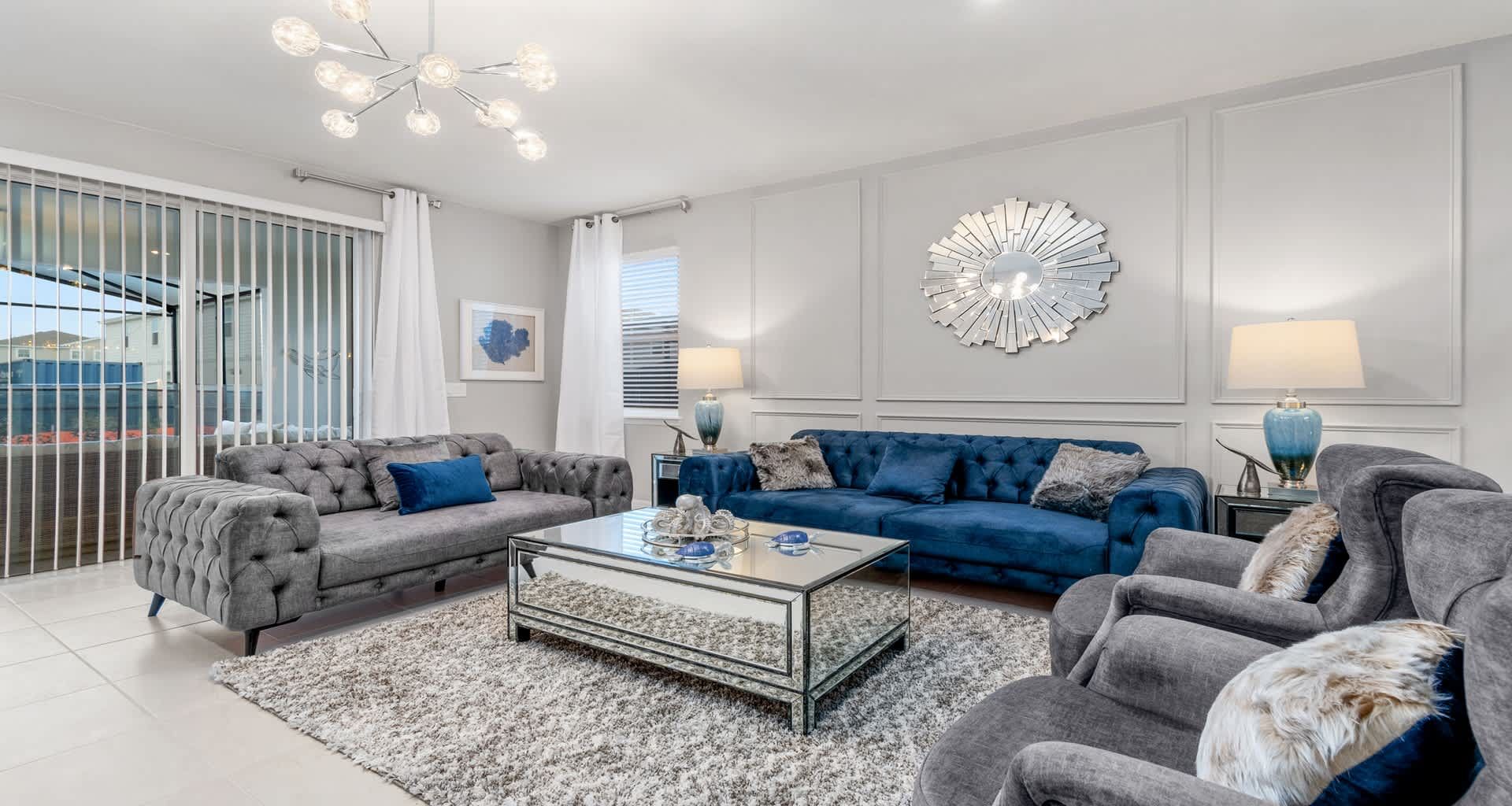 Elegant living room with plush seating, chic decor, and plenty of natural light!
