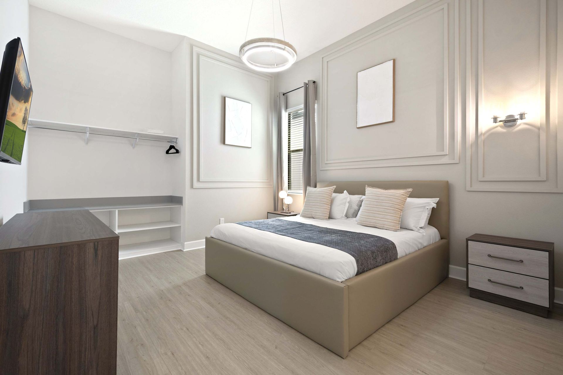 Elegant queen room with accent molding, designer lighting, and open closet. 