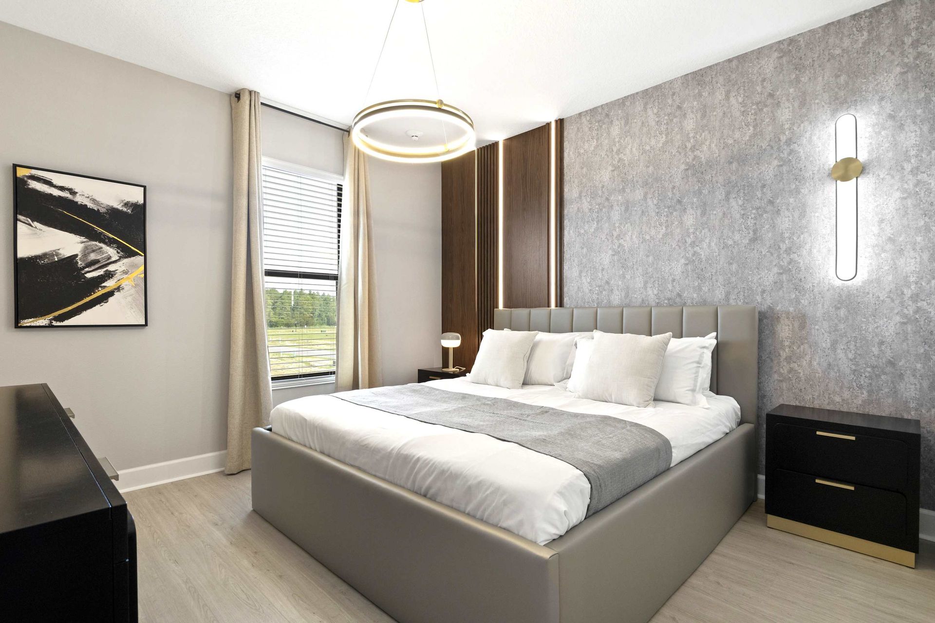 Textured walls, accent lighting, and a plush king bed. Pure luxury. 