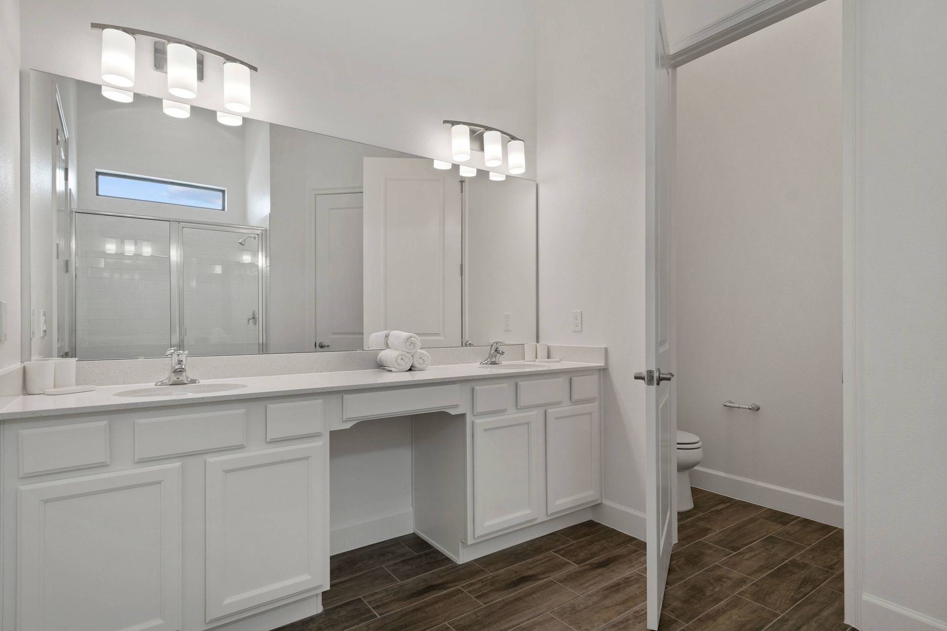 Clean and modern: crisp white cabinetry and tiled floors. 