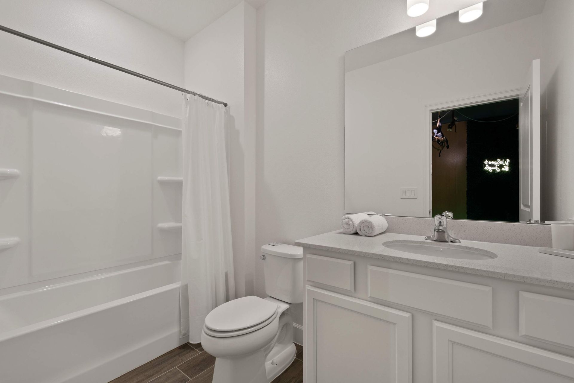 Crisp, clean bathroom: everything is bright and new.