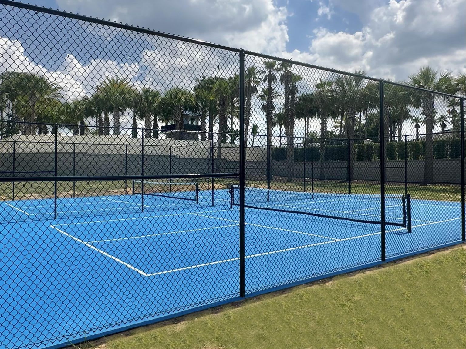 Sunny blue tennis and basketball courts for fun outdoor games and family activities
