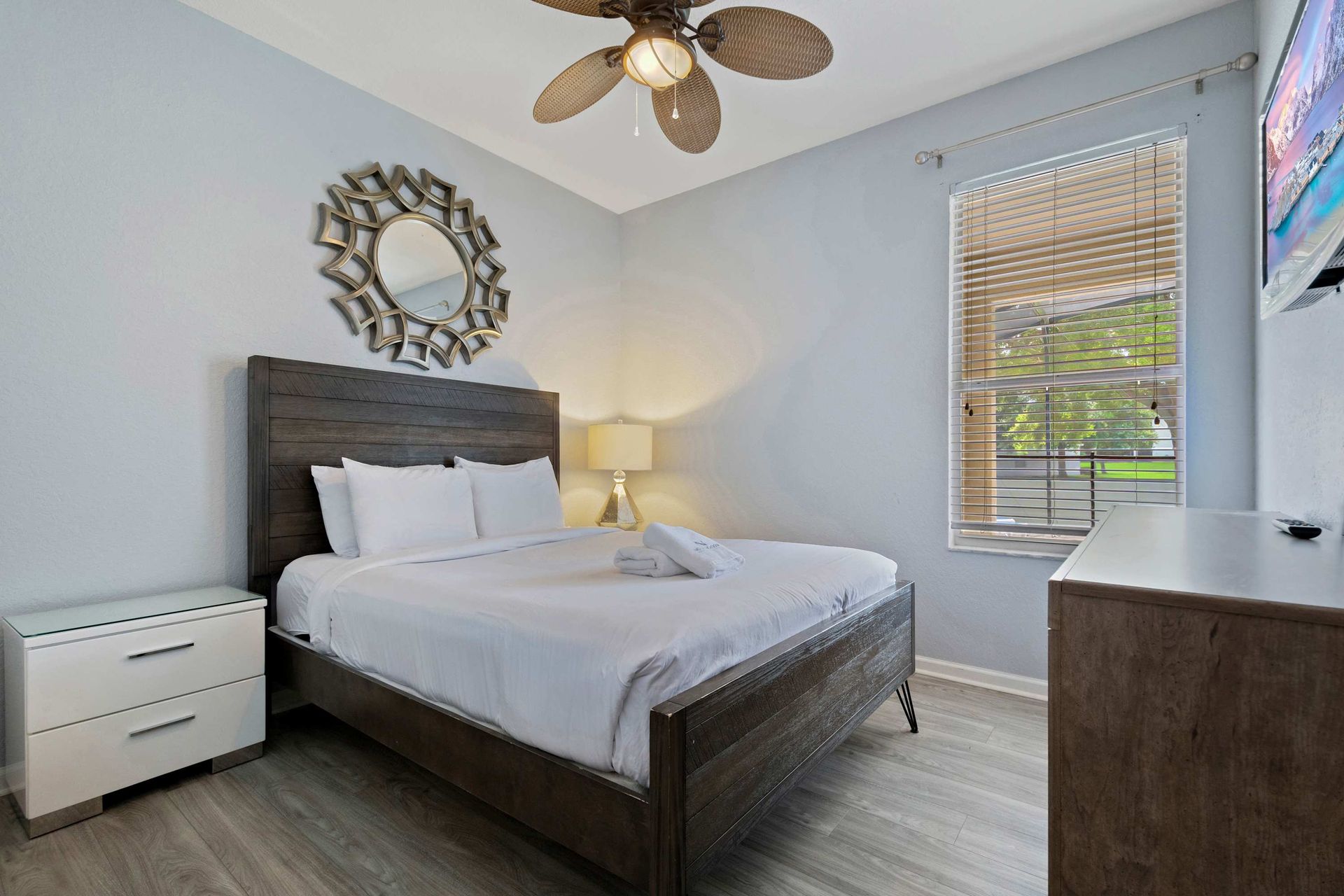 Cozy king bedroom with modern décor, natural light, and a peaceful vibe
