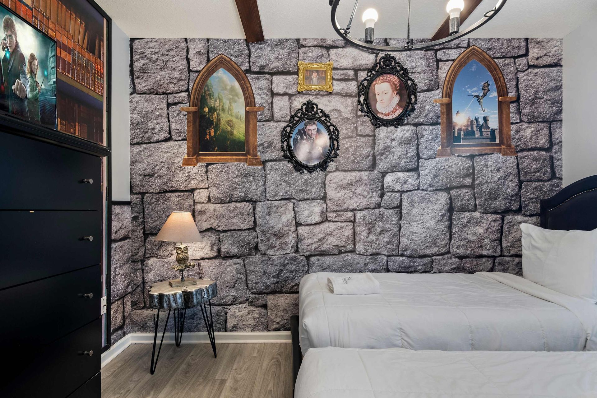 Whimsical wizard-themed room with castle walls and cozy beds for magical stays
