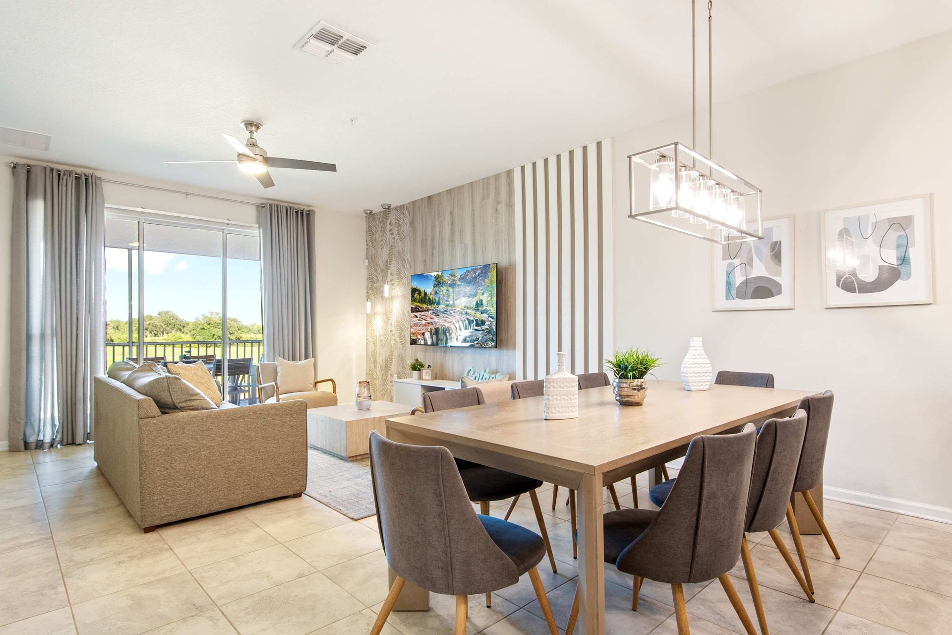 Seamless flow from elegant dining to a cozy lounge with a sunlit view.