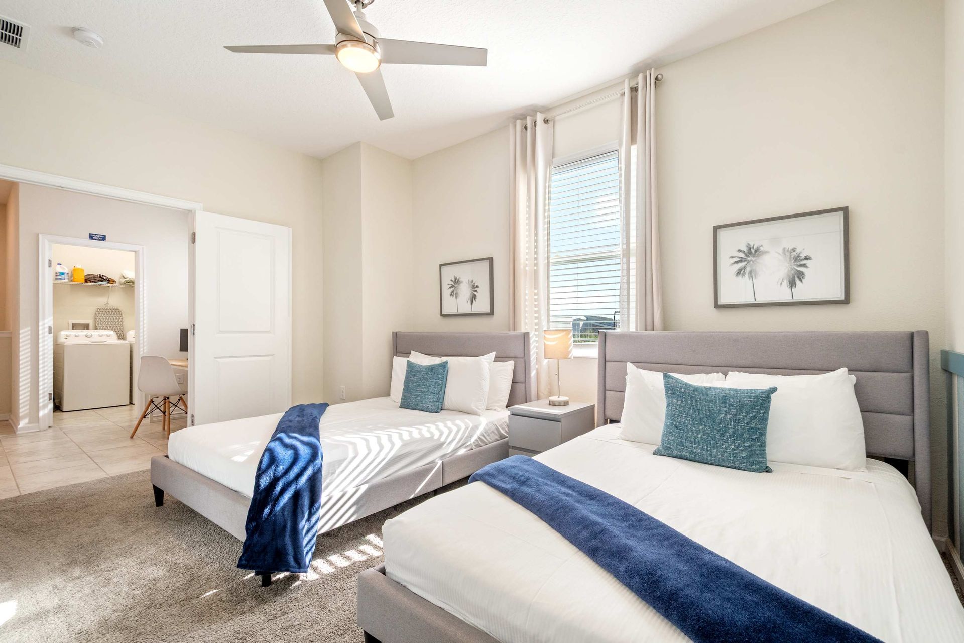 Two comfy Queen beds, ceiling fan, and direct access to laundry room.