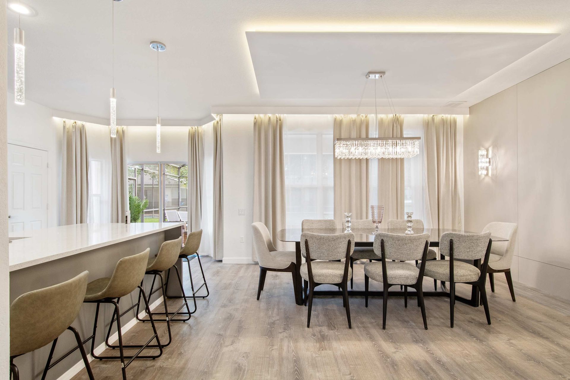 Clean, bright, and polished: perfect entertaining space with chic lighting. 