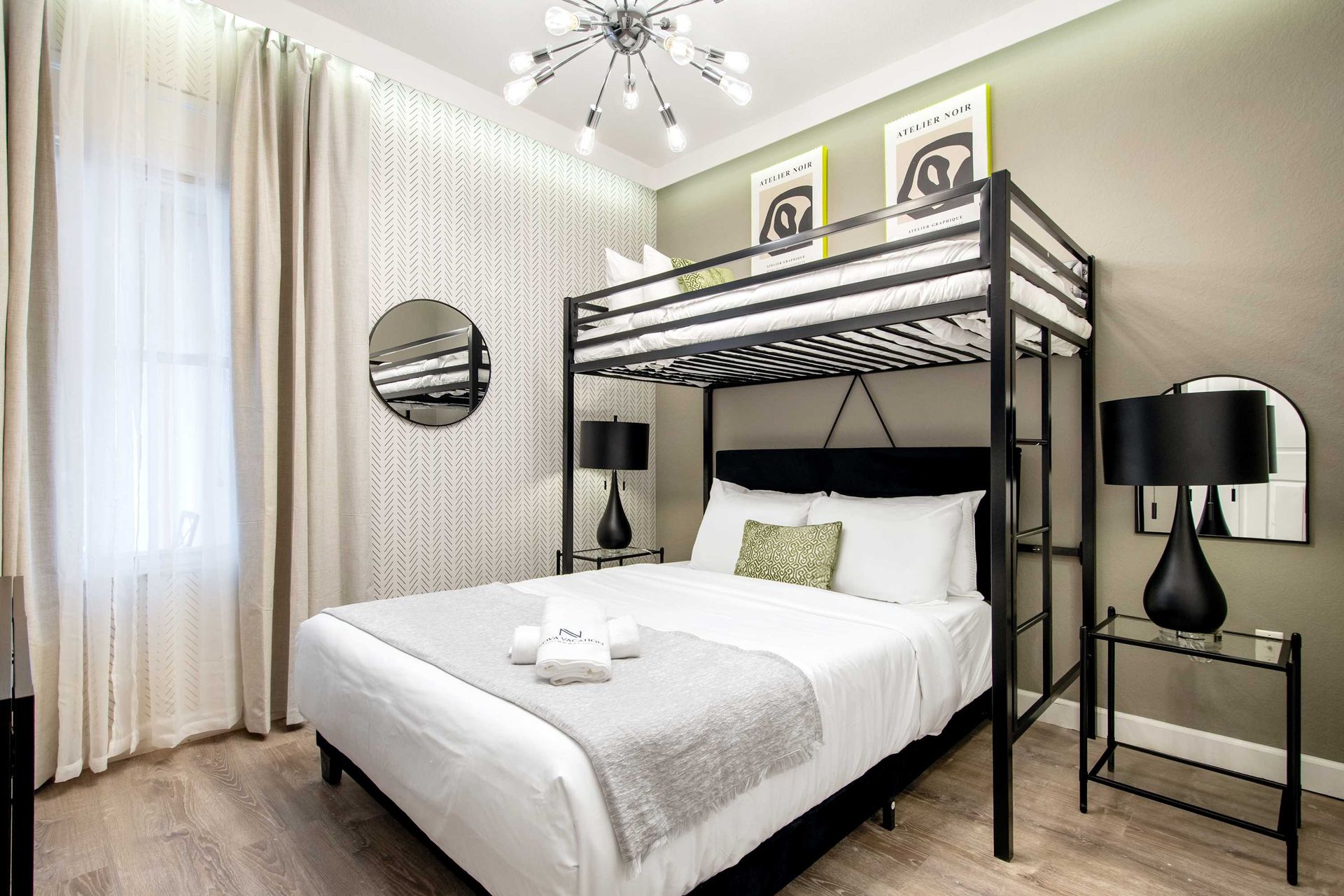 Sleek black-and-white with twin-over-queen bunk — perfect for teens