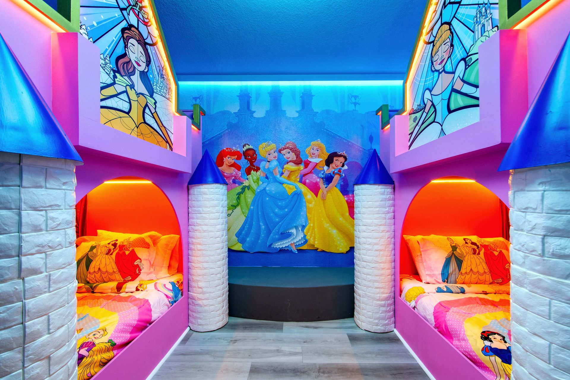 Twin bunk beds in a royal-pink room made for little queens