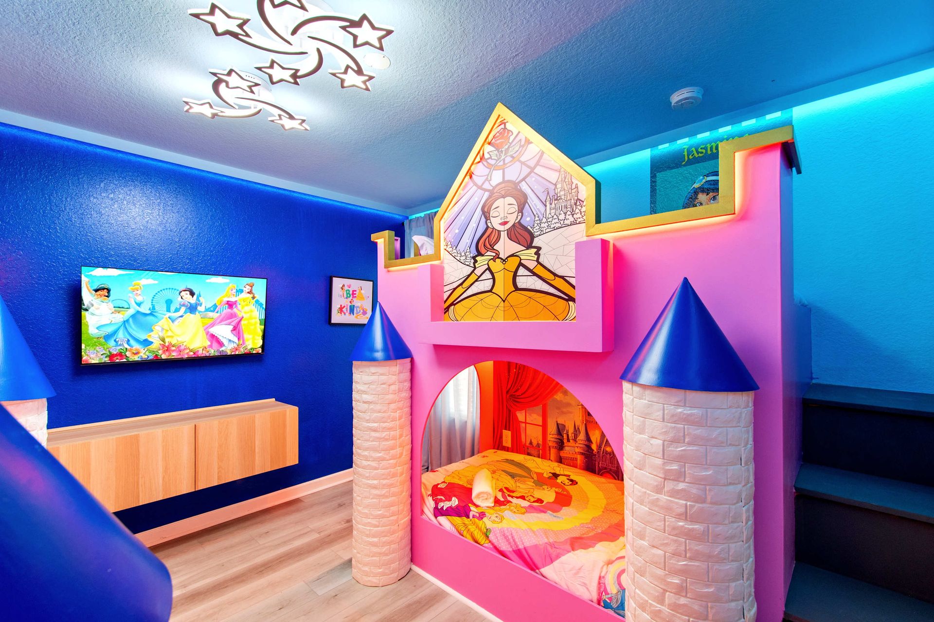 Royal slumber: custom castle bed, slide, and TV for movie time. 